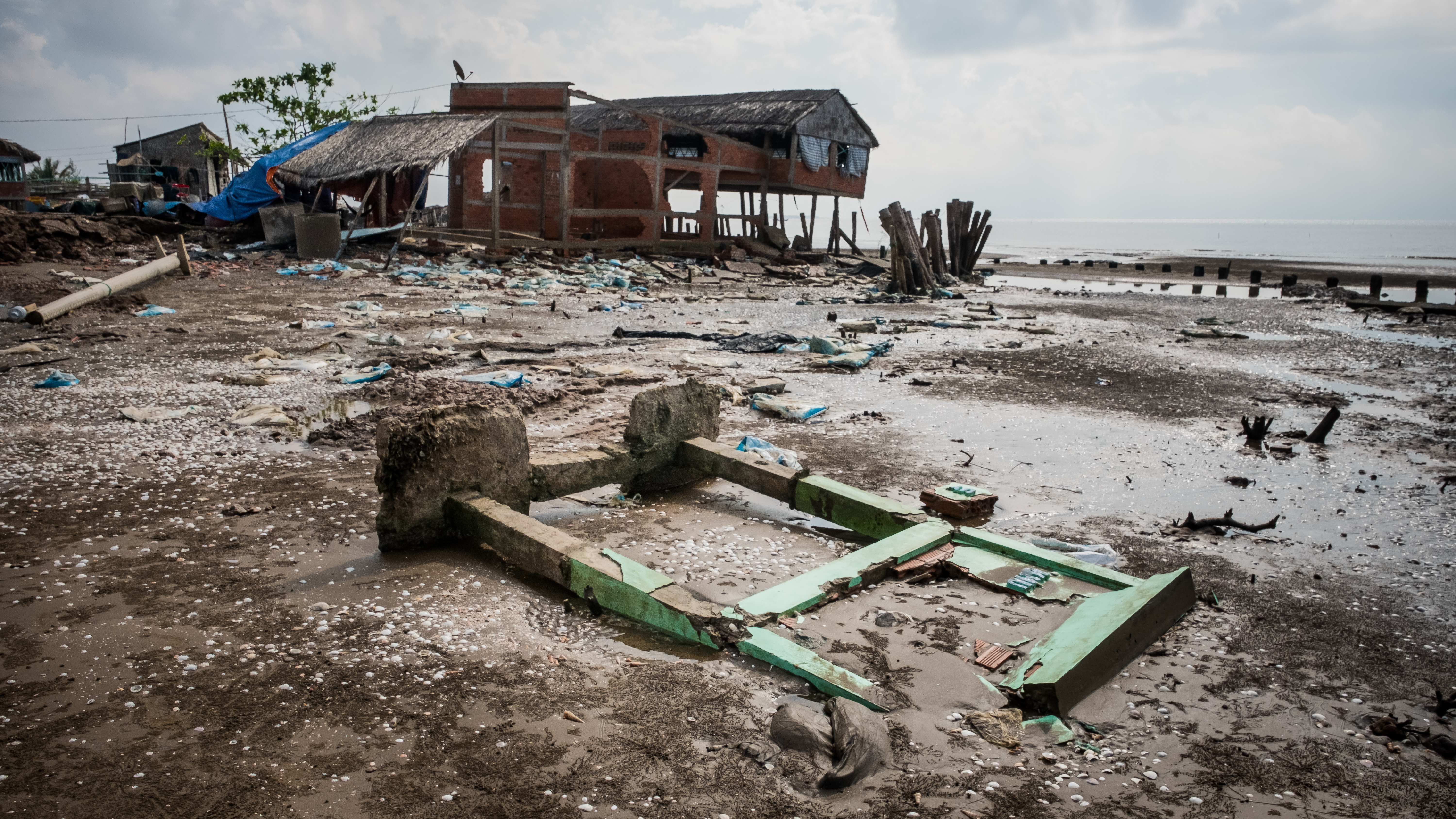 High tides have destroyed roads and structures in Vietnam as rising sea levels threaten farmland in the country
