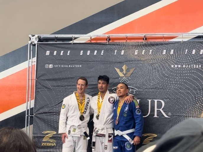 Mark Zuckerberg, left, alongside Jeff Ibrahim, center, following their jiu-jitsu match on May 6 in California. One of the third place competitors, Henry Francisco, is at right. (Sooner Ibrahim)