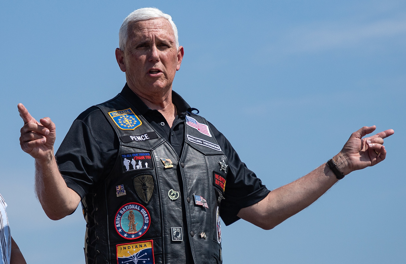 Former Vice President Mike Pence speaks to a crowd of motorcycle riders and the press before riding a motorcycle to the Iowa state fairgrounds for Iowa GOP Sen. Joni Ernst's Roast and Ride fundraiser on June 3. (Iowa Public Radio)