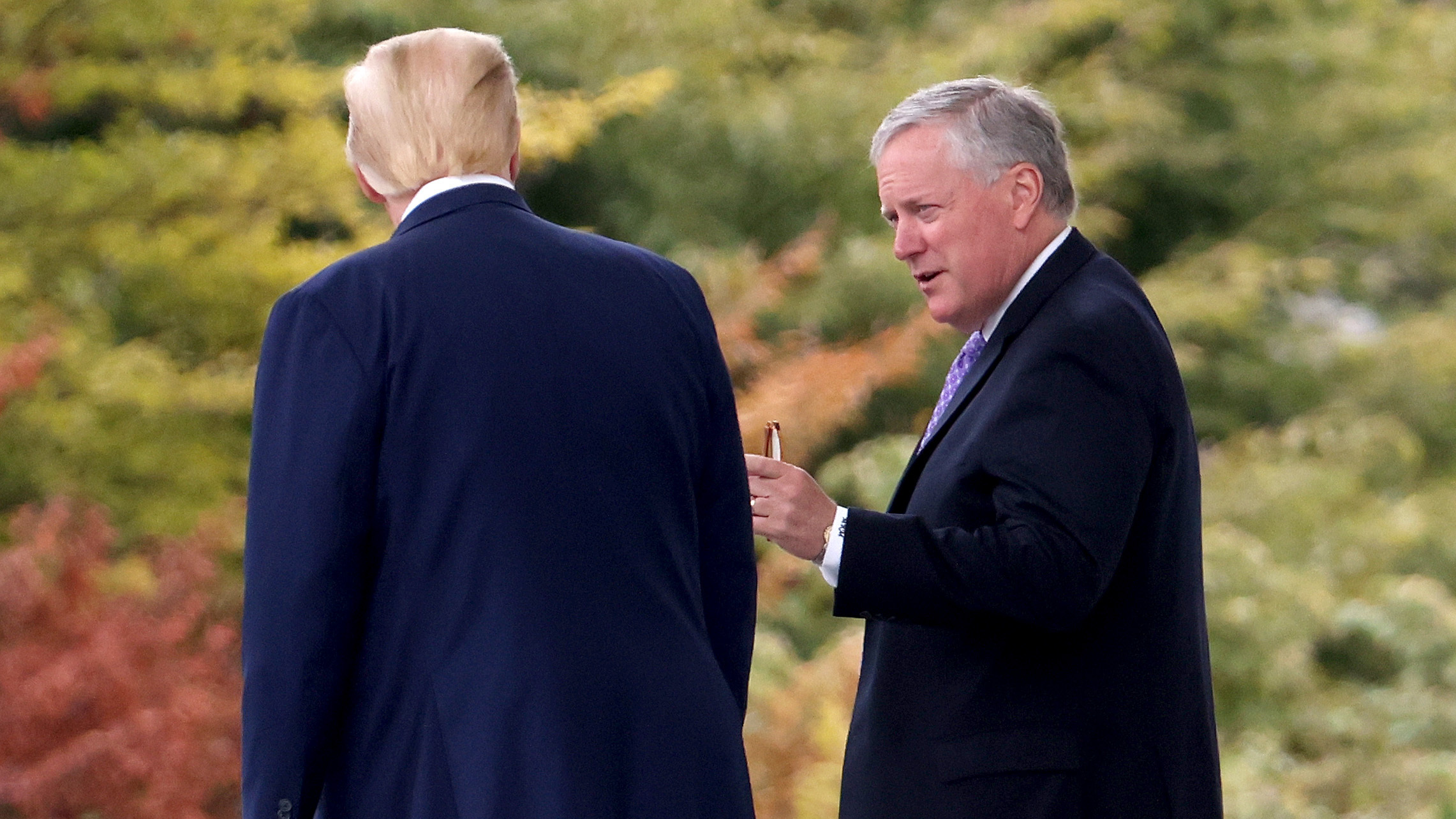 U.S. President Donald Trump confers with White House Chief of Staff Mark Meadows while departing the White House September 1, 2020 in Washington, DC.