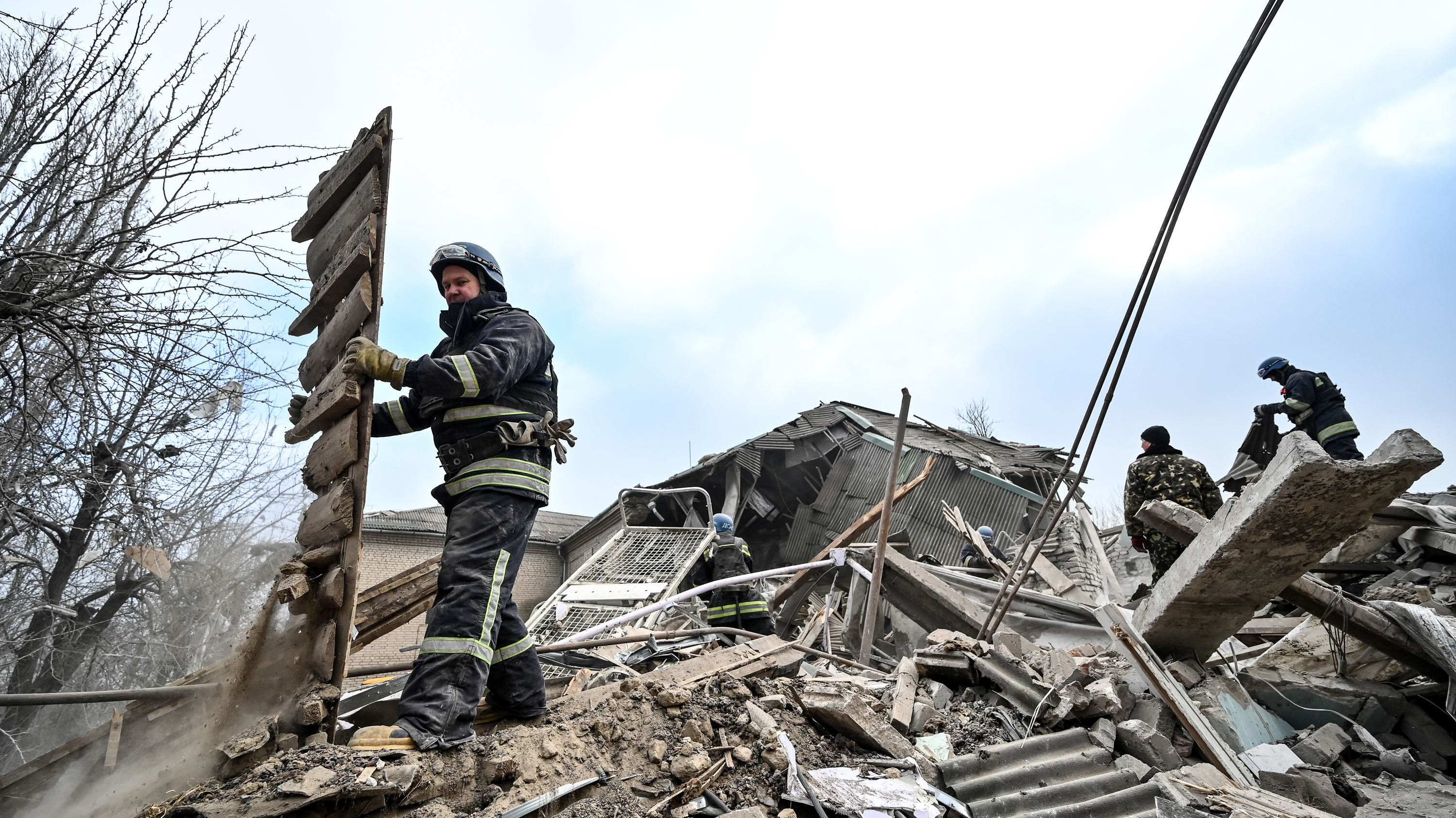 Rescuers remove rubble at the maternity ward of the Vilniansk Multidisciplinary Hospital in Ukraine, one of the countries experiencing an increase in violence against health care workers.