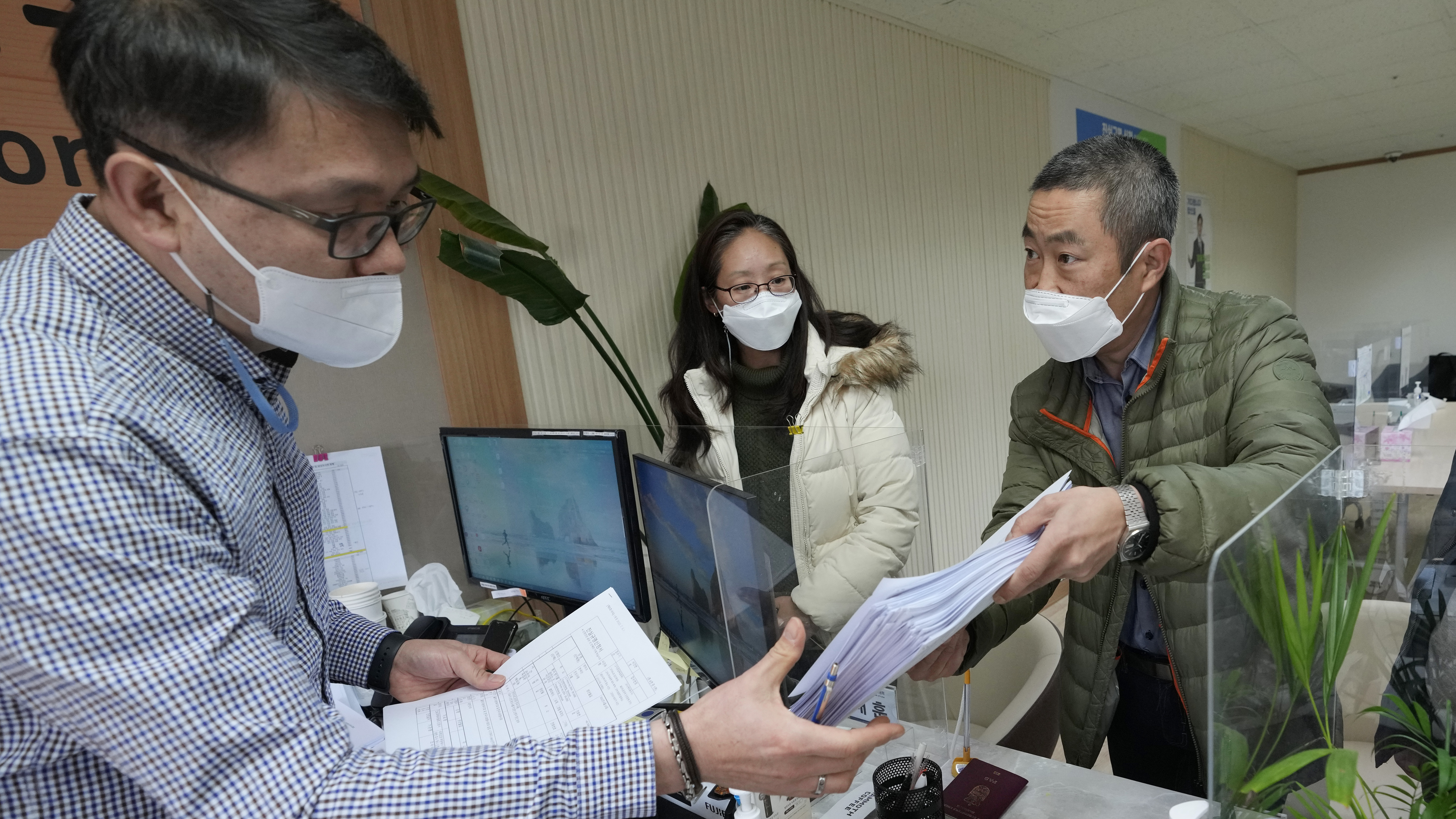 Peter Møller, second from right, attorney and co-founder of the Danish Korean Rights Group, submits the documents at the Truth and Reconciliation Commission in Seoul, South Korea, Nov. 15, 2022.