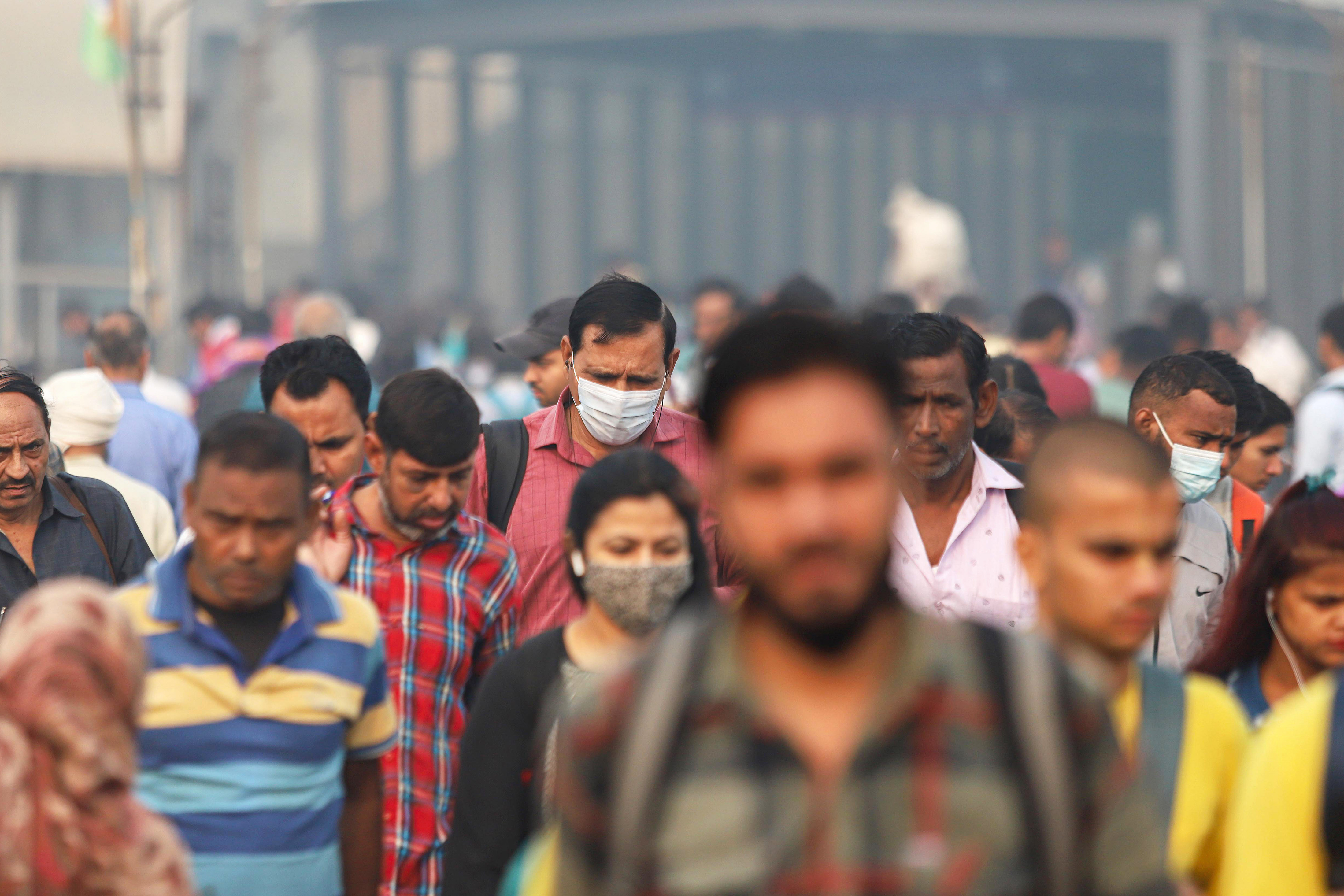 Here's how NPR reporters around the world are dealing with air pollution 2 Commuters walk in New Delhi on a smoggy day amid deteriorating air quality levels on Nov. 11, 2022.