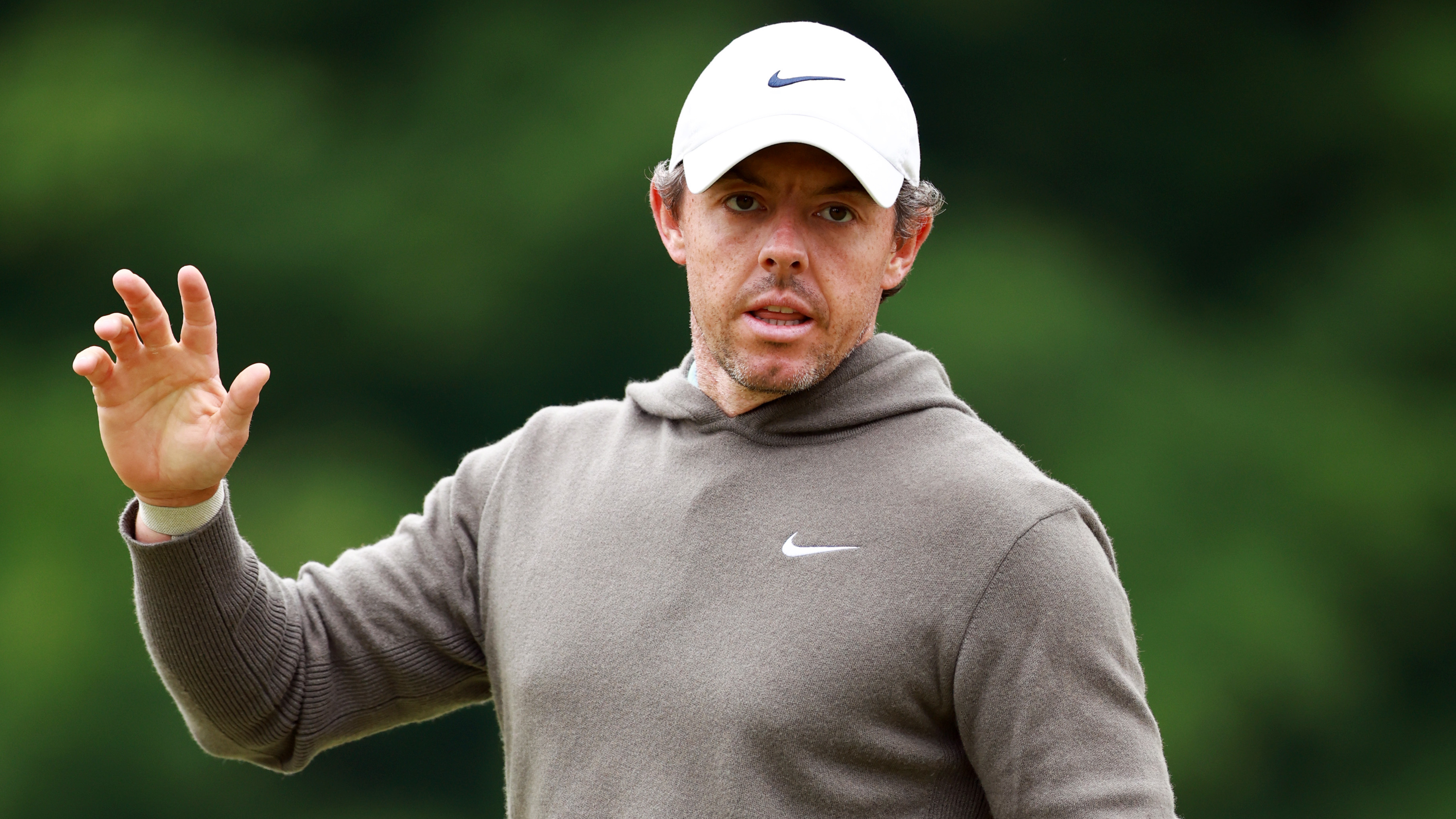 Rory McIlroy started defense of his title at the RBC Canadian Open in Toronto on Thursday. But before play began, he was peppered with questions about the PGA Tour's new merger that ends its spat with LIV Golf. (Getty Images)