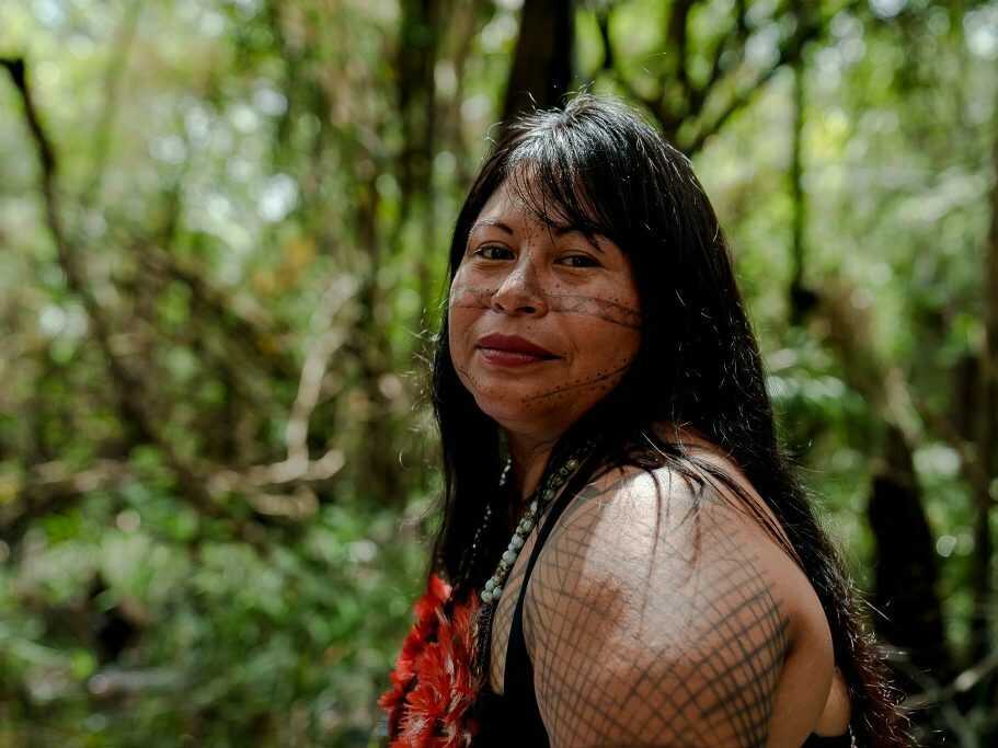 Brazilian urban indigenous youth gives haircut to other