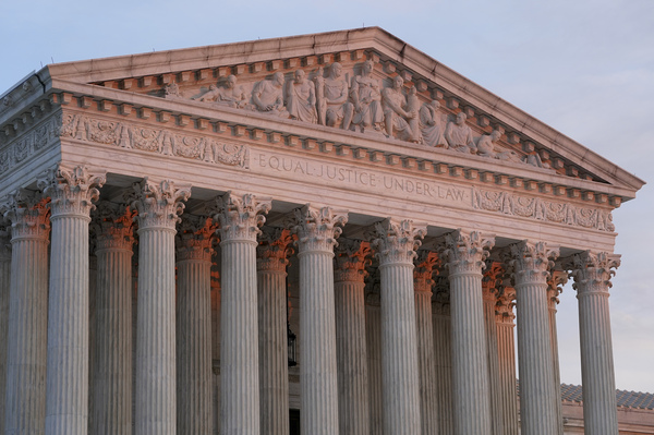 The setting sun illuminates the Supreme Court building on Capitol Hill in Washington on Jan. 10, 2023.