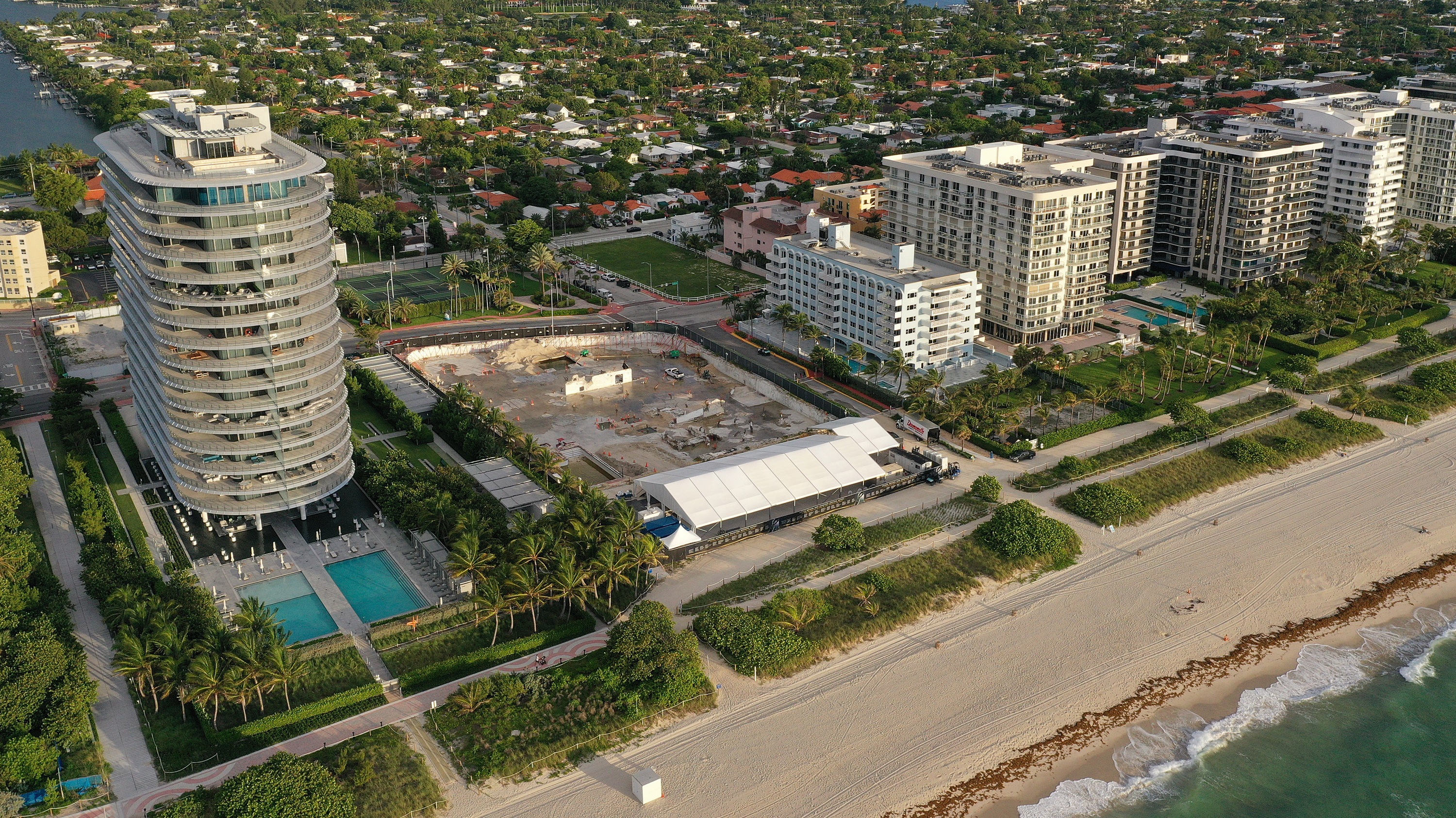 In an aerial view, a cleared lot where the 12-story Champlain Towers South condo building once stood is seen on June 22, 2022 in Surfside, Fla - a year after the tragic event where 98 people died when the building partially collapsed in 2021.