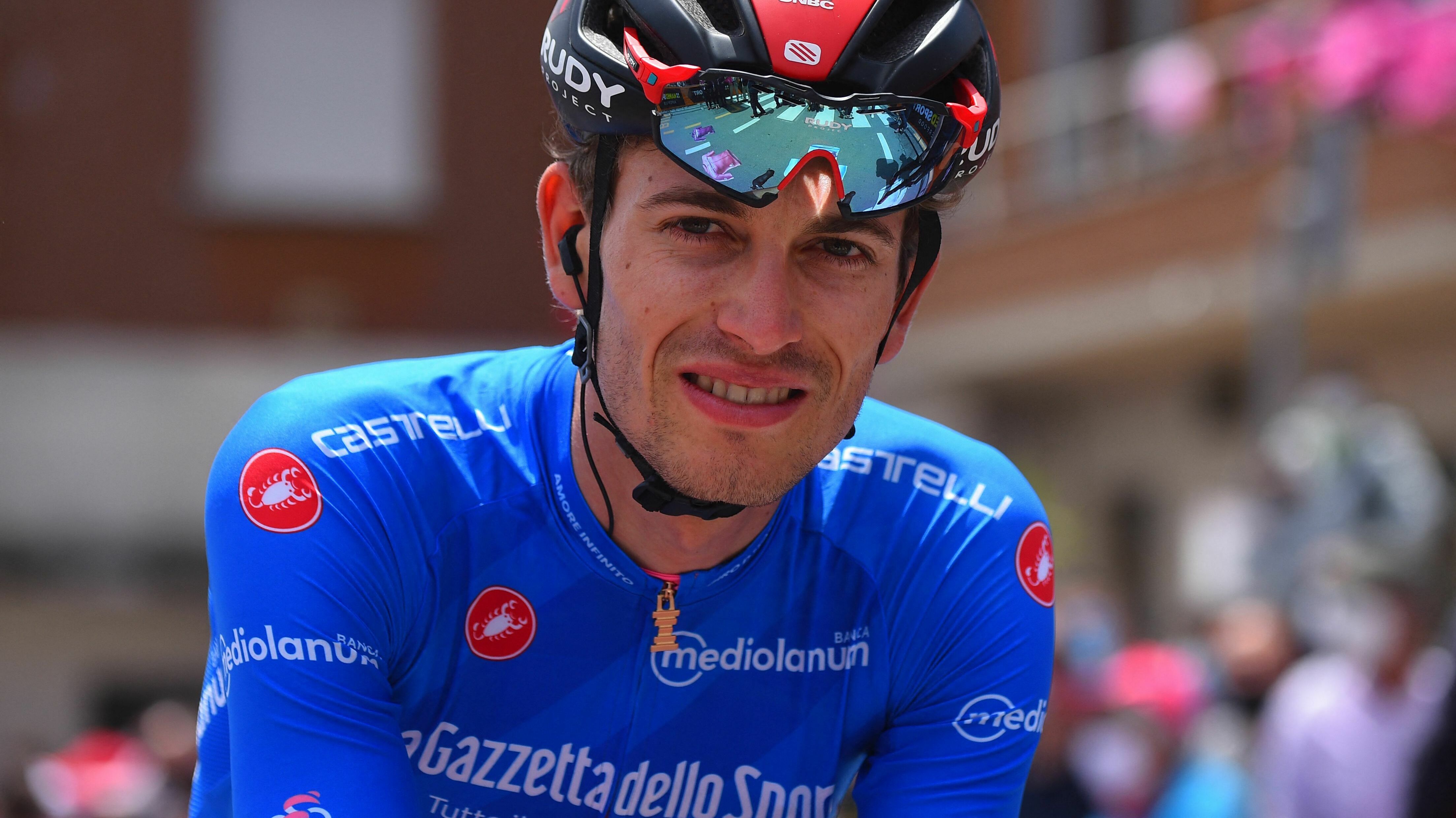 Team Bahrain cyclist Gino Mäder of Switzerland died after suffering a terrible crash in the Tour de Suisse. He's seen here at the 2021 Giro d'Italia road race, wearing the blue jersey signifying the best climber. (AFP via Getty Images)