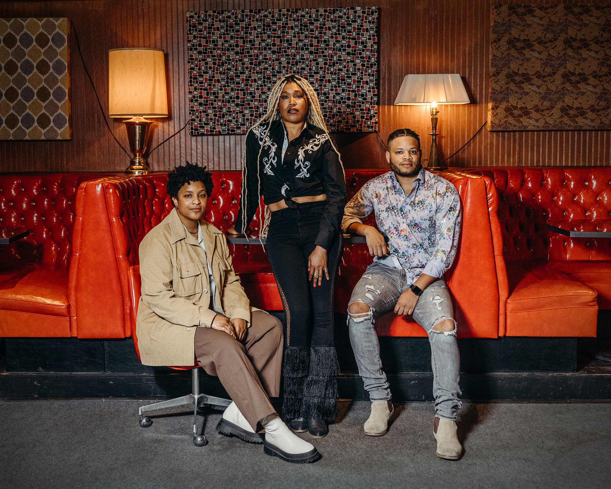 Musicians Denitia, Larysa Jaye and Tylar Bryant pose for a photo before their set at Lulu's Downstairs in Manitou Springs, Colo., on June 17, 2023. They are members of the Black Opry, a touring musical revue dedicated to uplifting Black artists in country music. (Amanda Lopez for NPR)