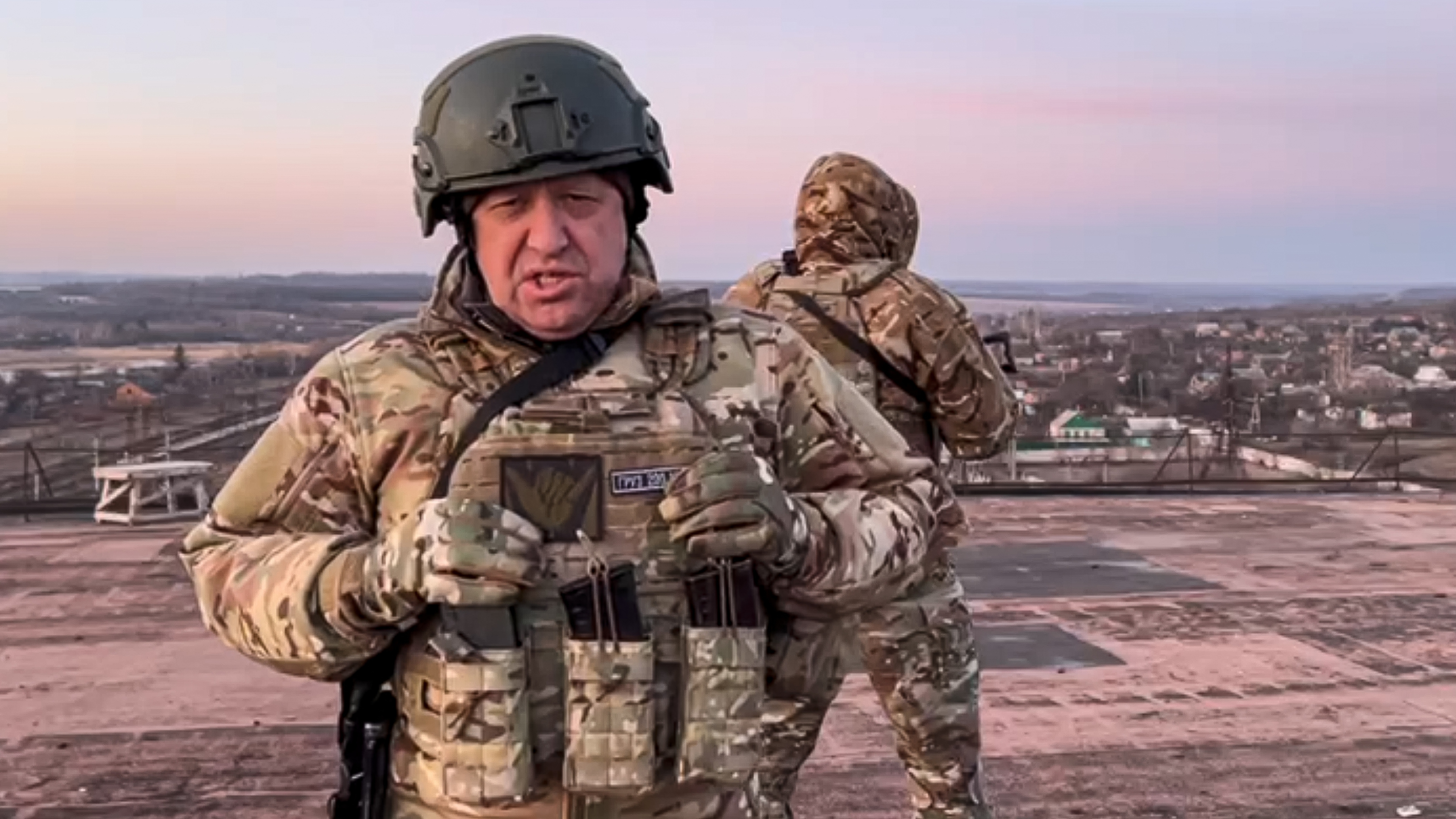 In this handout photo taken from video released by Prigozhin Press Service on Friday, March 3, 2023, Yevgeny Prigozhin, the owner of the Wagner Group military company, addresses Ukrainian President Volodymyr Zelenskyy asking him to withdraw the remaining Ukrainian forces from Bakhmut to save their lives, at an unspecified location in Ukraine.