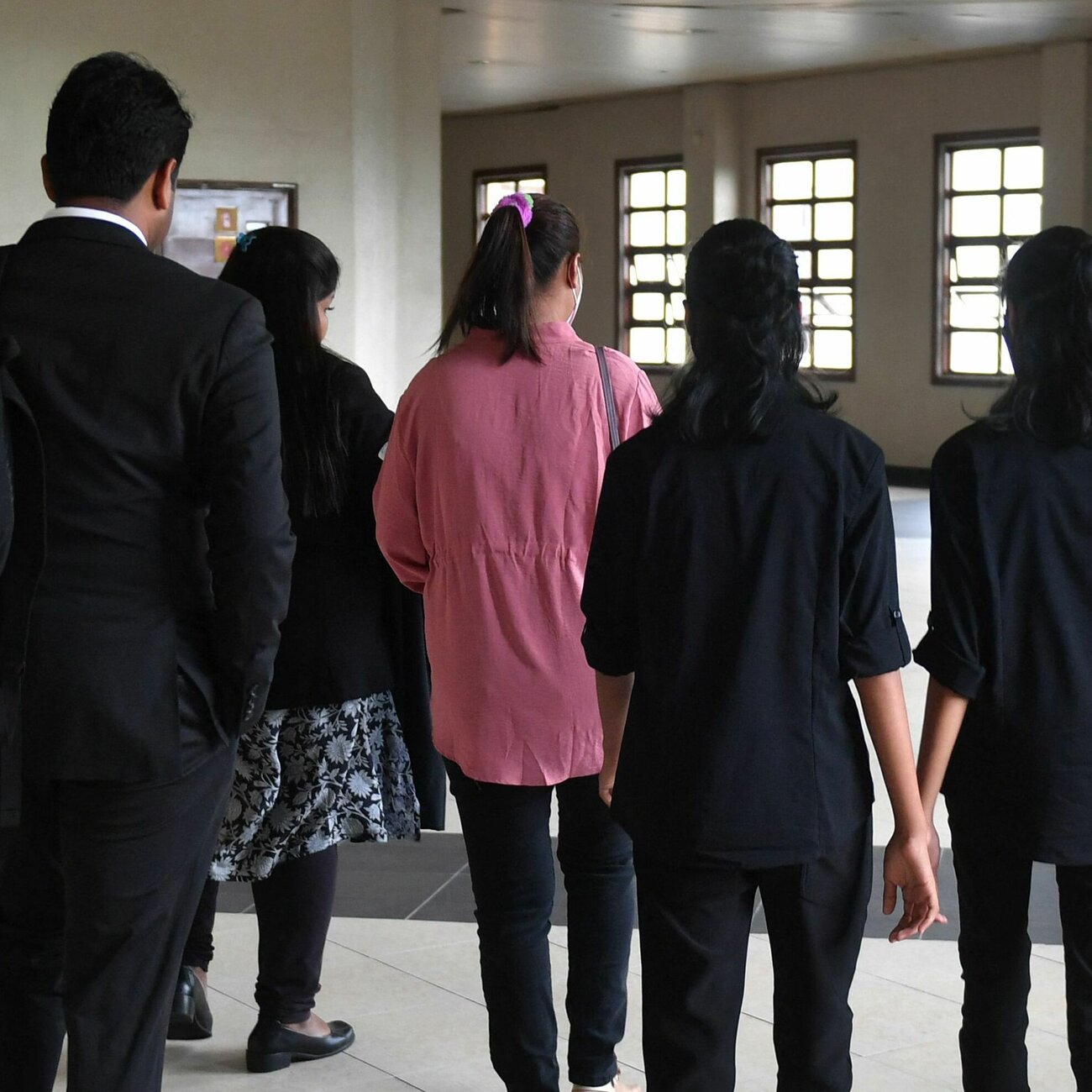 In Malaysia, a mom is contesting her kids' conversion to Islam. It's a landmark case