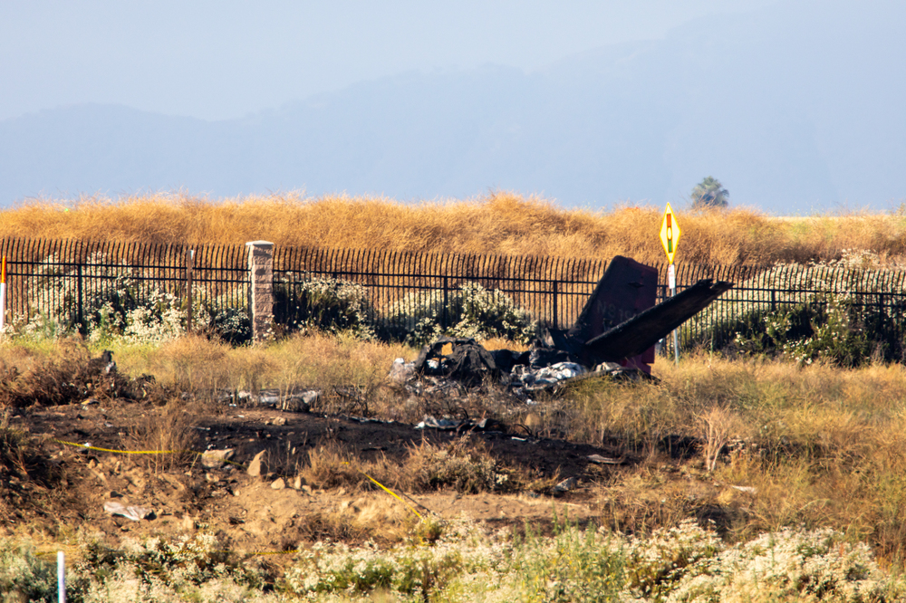 A business jet crashed into a field on Saturday morning, killing six people aboard, Riverside County authorities said. Charred remains of the Cessna C550 lies near the landing approach at French Valley Airport, in Murrieta, Calif. (Los Angeles Times via Getty Images)