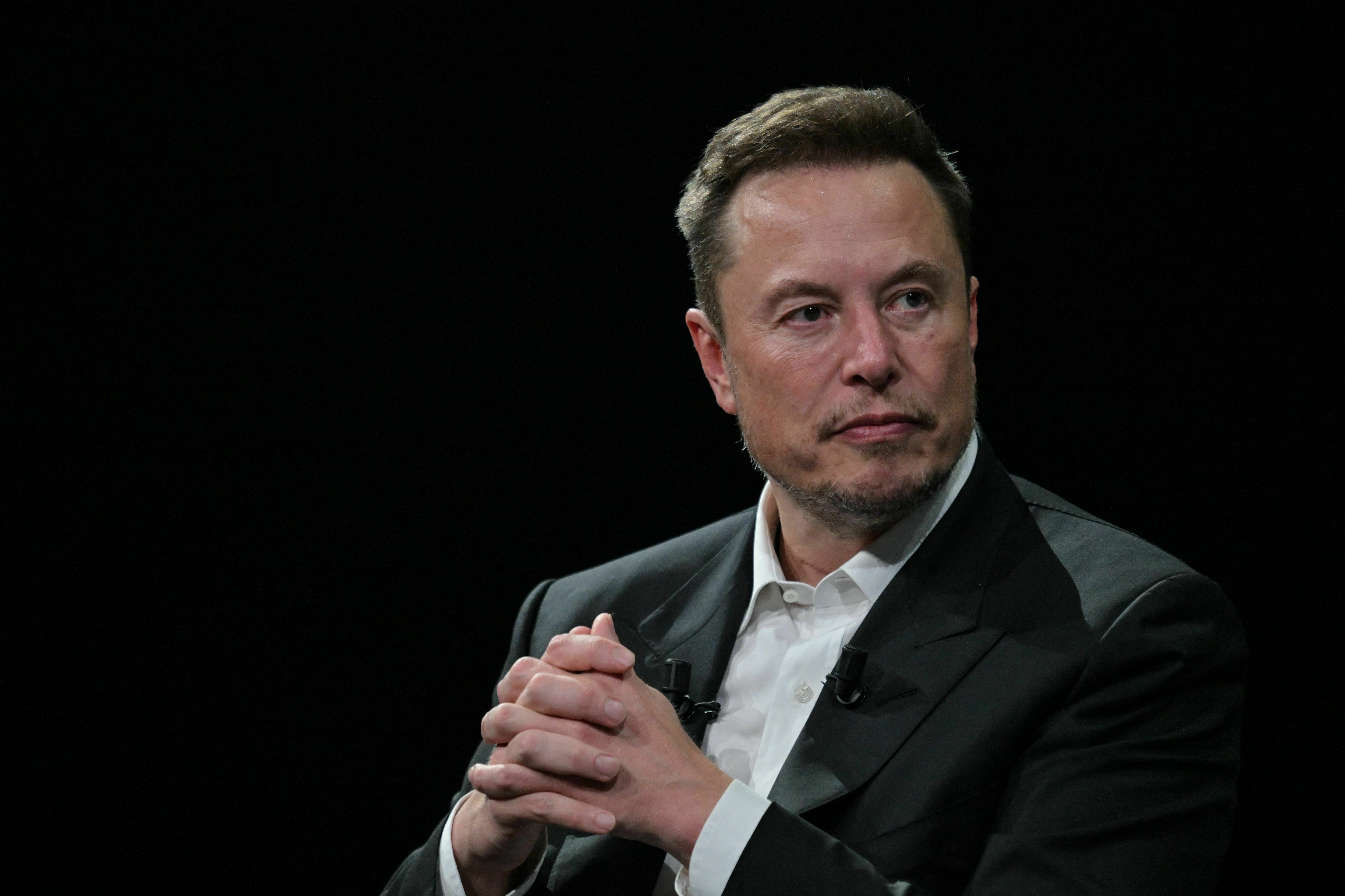 Elon Musk looks on during his visit to the Vivatech technology startups and innovation fair at the Porte de Versailles exhibition center in Paris on June 16. (AFP via Getty Images)