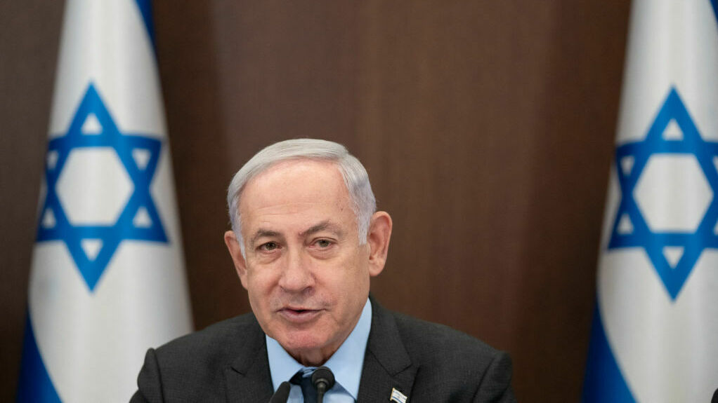 Israel's Prime Minister Benjamin Netanyahu is pictured at his office in Jerusalem on Monday. Netanyahu spoke with President Biden, who invited him for a meeting later this year. (Pool/AFP via Getty Images)