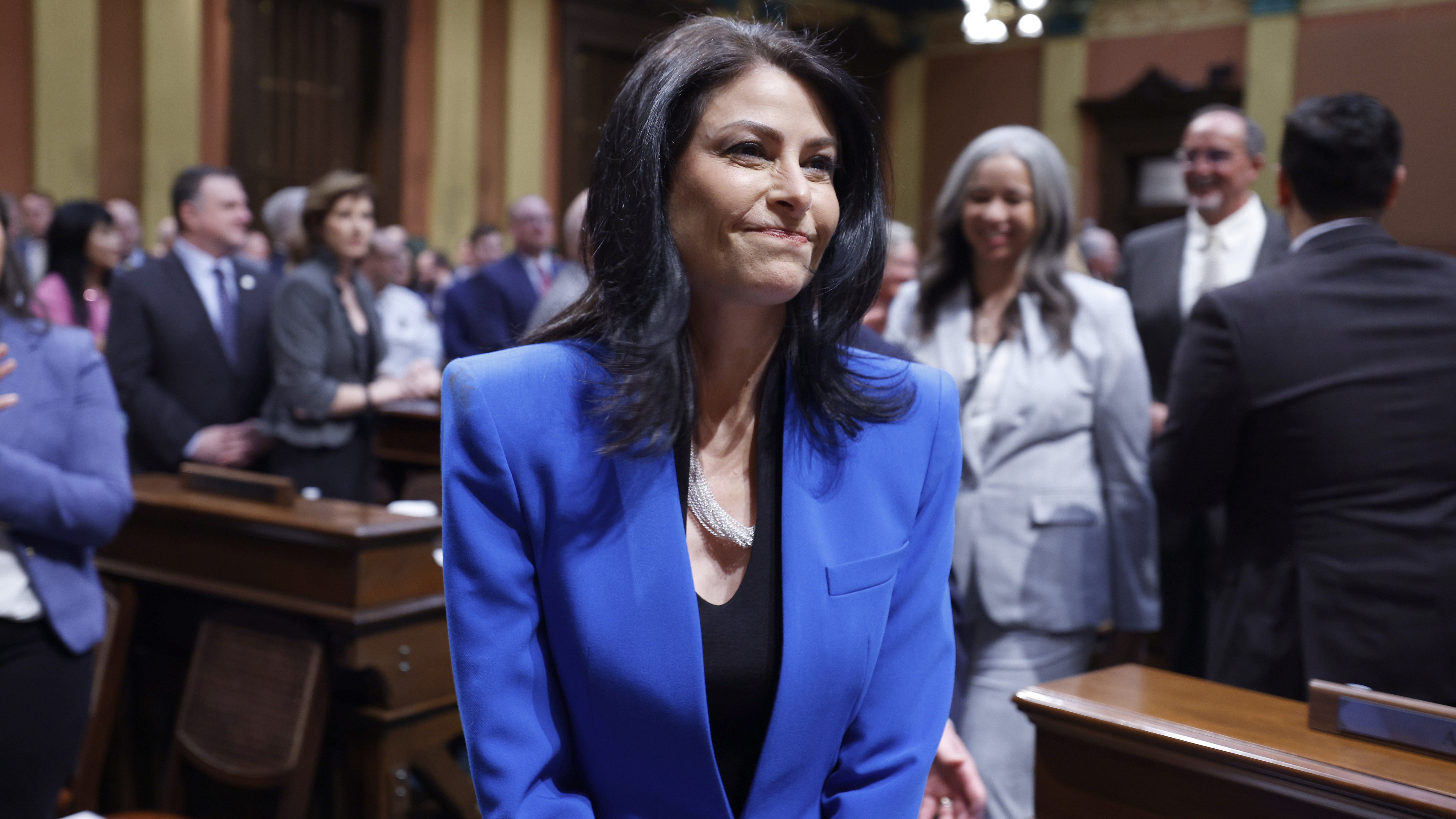 Michigan Attorney General Dana Nessel walks to her seat before the State of the State address on Jan. 25 at the state Capitol in Lansing, Mich.