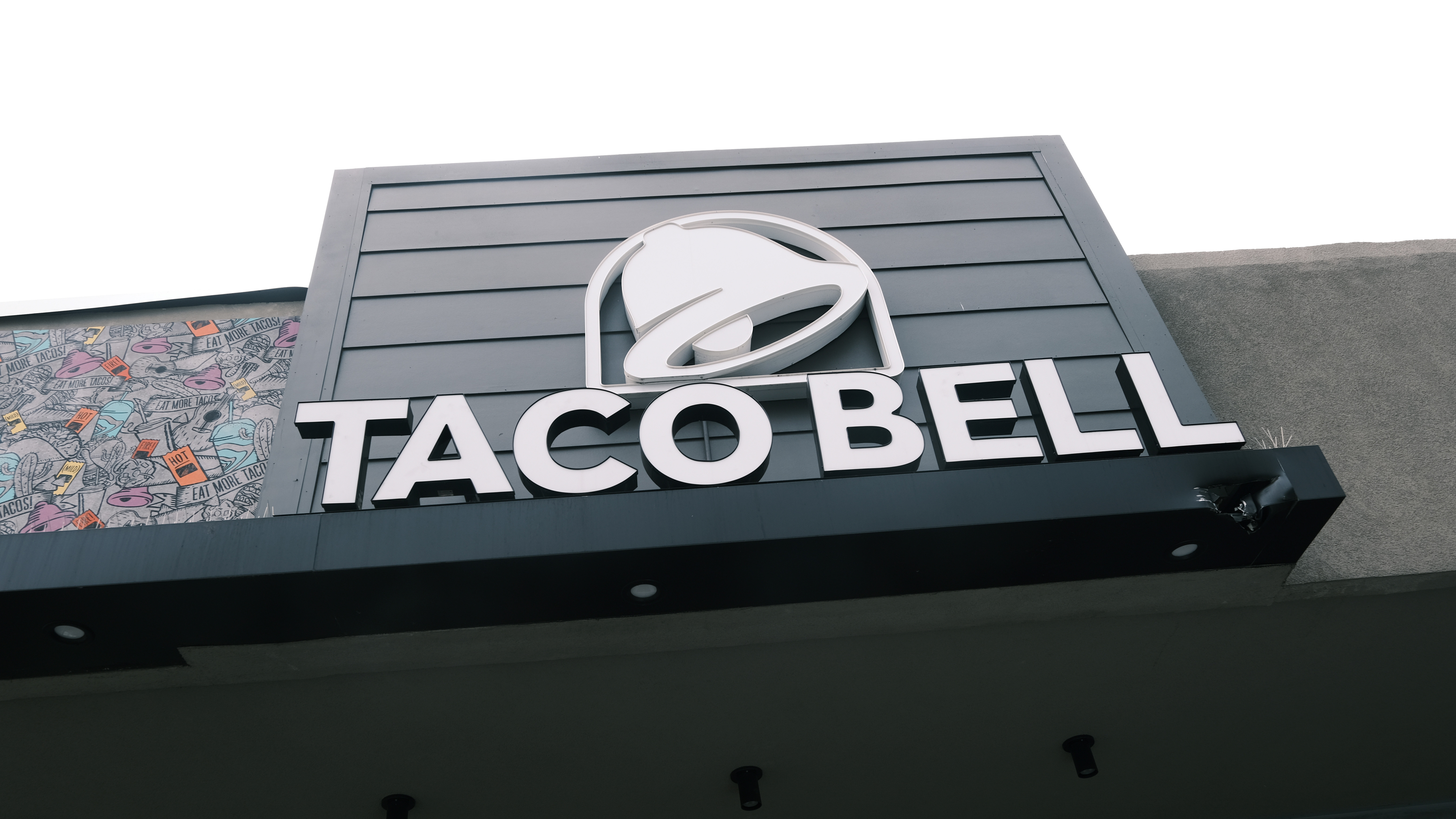 A Taco Bell restaurant stands along a Queens street on July 21, 2021 in New York City.