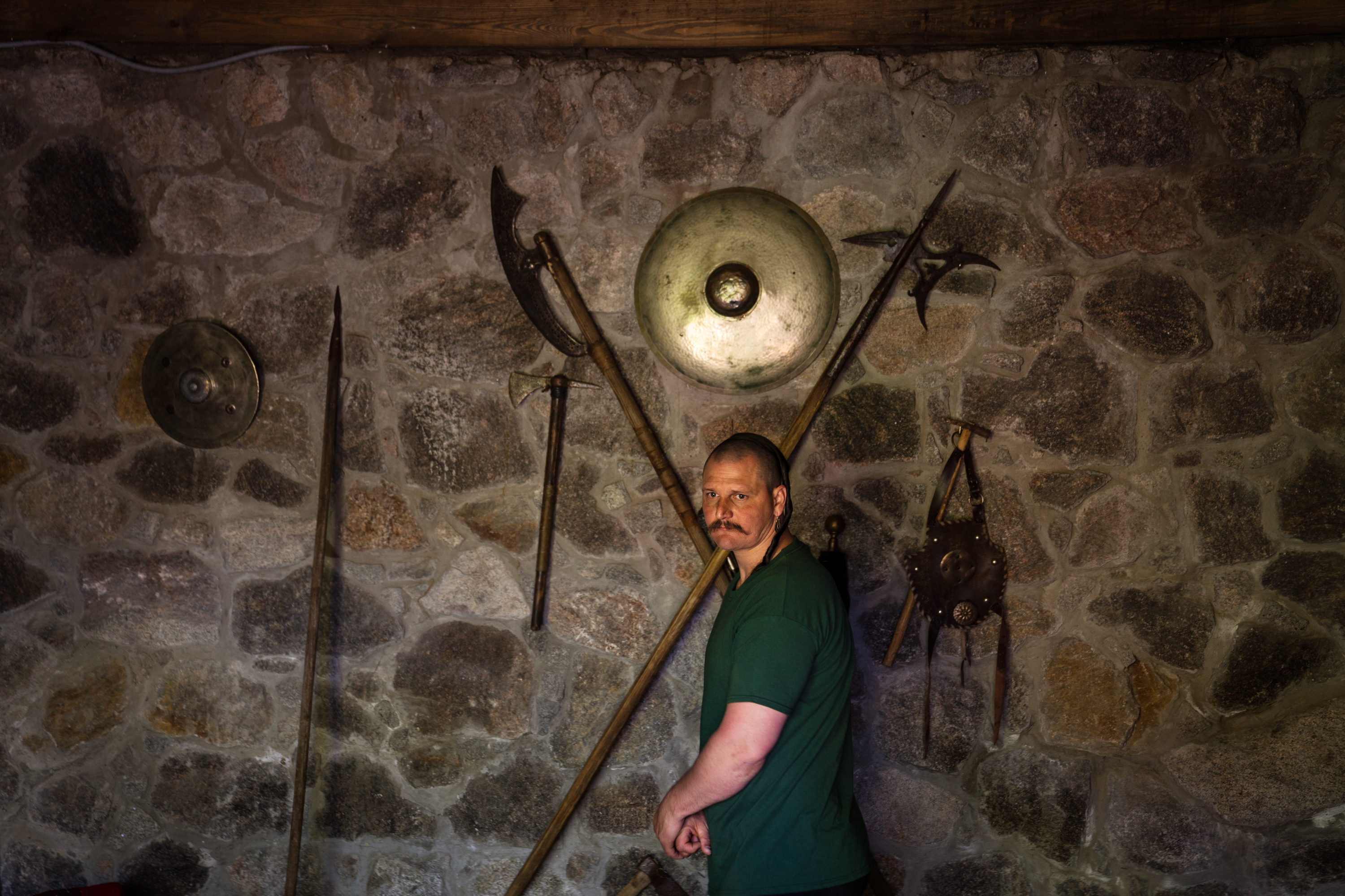 The Cossacks' traditions live on near the front lines in Ukraine 6 Andrii Lozovyi stands near some traditional Cossack weapons.