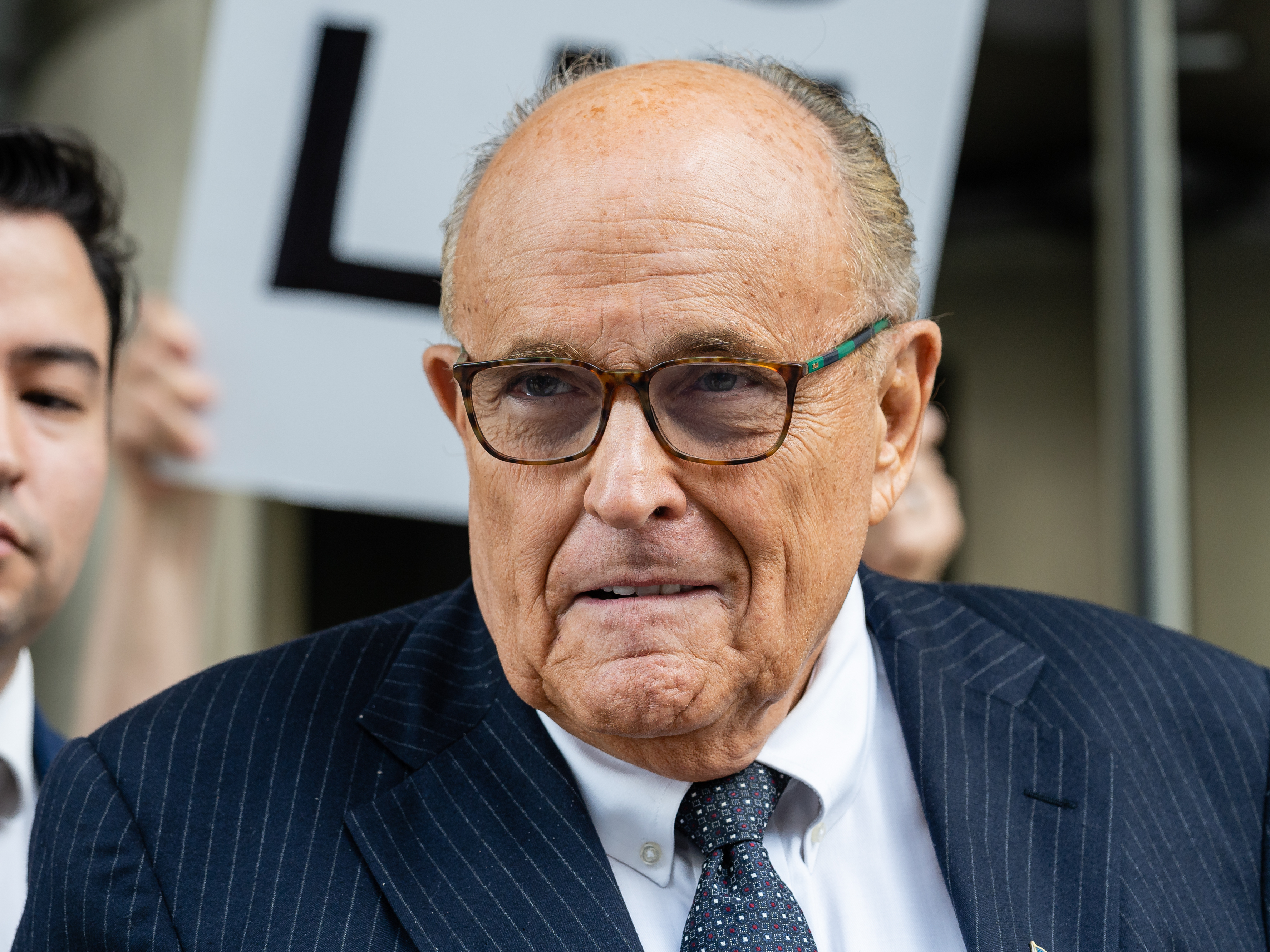 Rudy Giuliani, former lawyer to Donald Trump, exits federal court in Washington, D.C., on May 19. (Bloomberg via Getty Images)