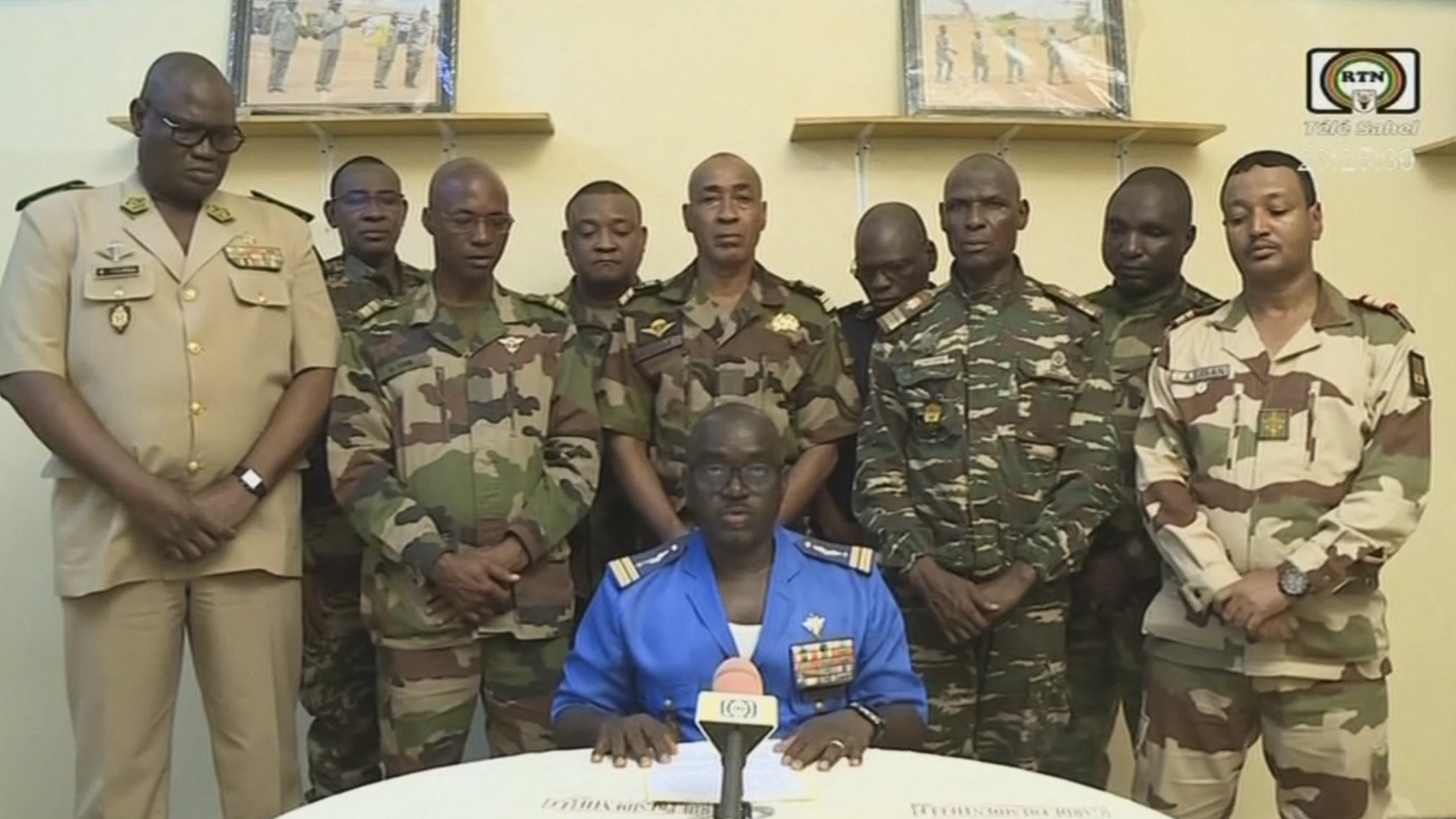 Col. Major Amadou Abdramane, center, is shown speaking during a televised statement. Soldiers claimed on July 26, 2023, to have overthrown the government of Niger President Mohamed Bazoum in a statement read out on national television.