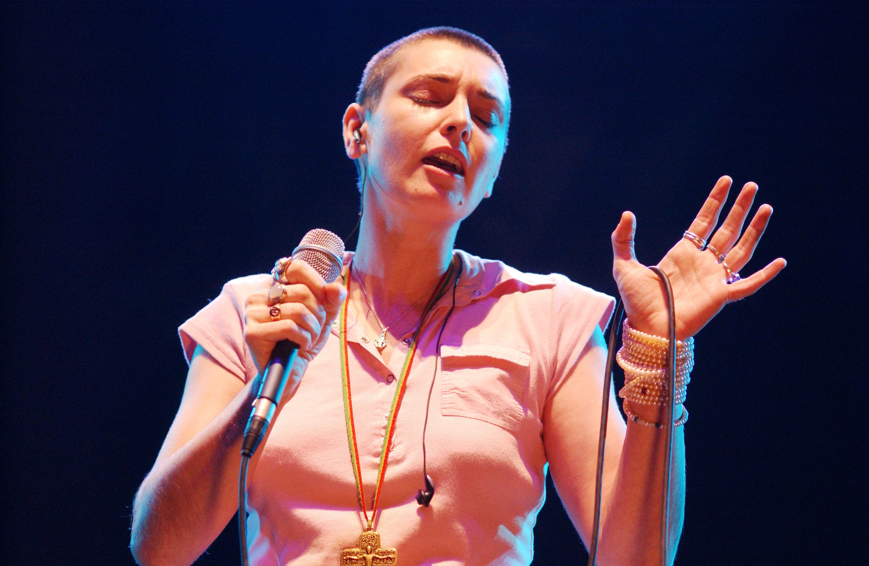 Sinéad O'Connor sings in concert in 2003 at The Point Theatre in Dublin, Ireland. O'Connor has died at 56. (Getty Images)