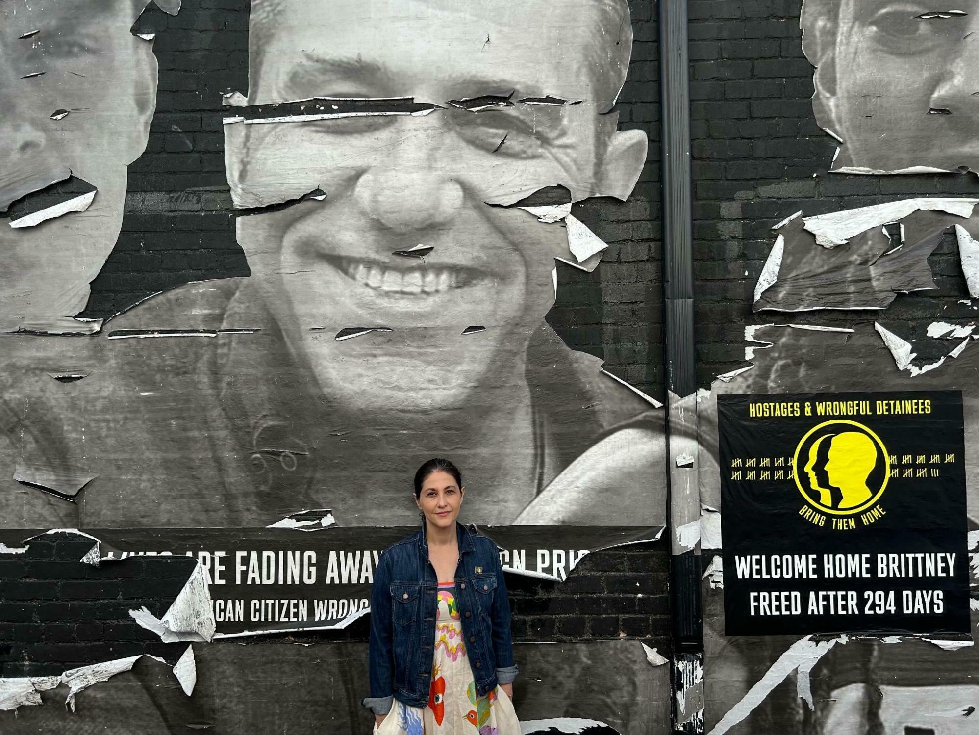 <em>&quot;It's not emotionally easy to come by here anymore,&quot; Neda Sharghi said of this alley in Washington, D.C. Her brother Emad Shargi, depicted above, remains in Iran's Evin prison.</em> (NPR)