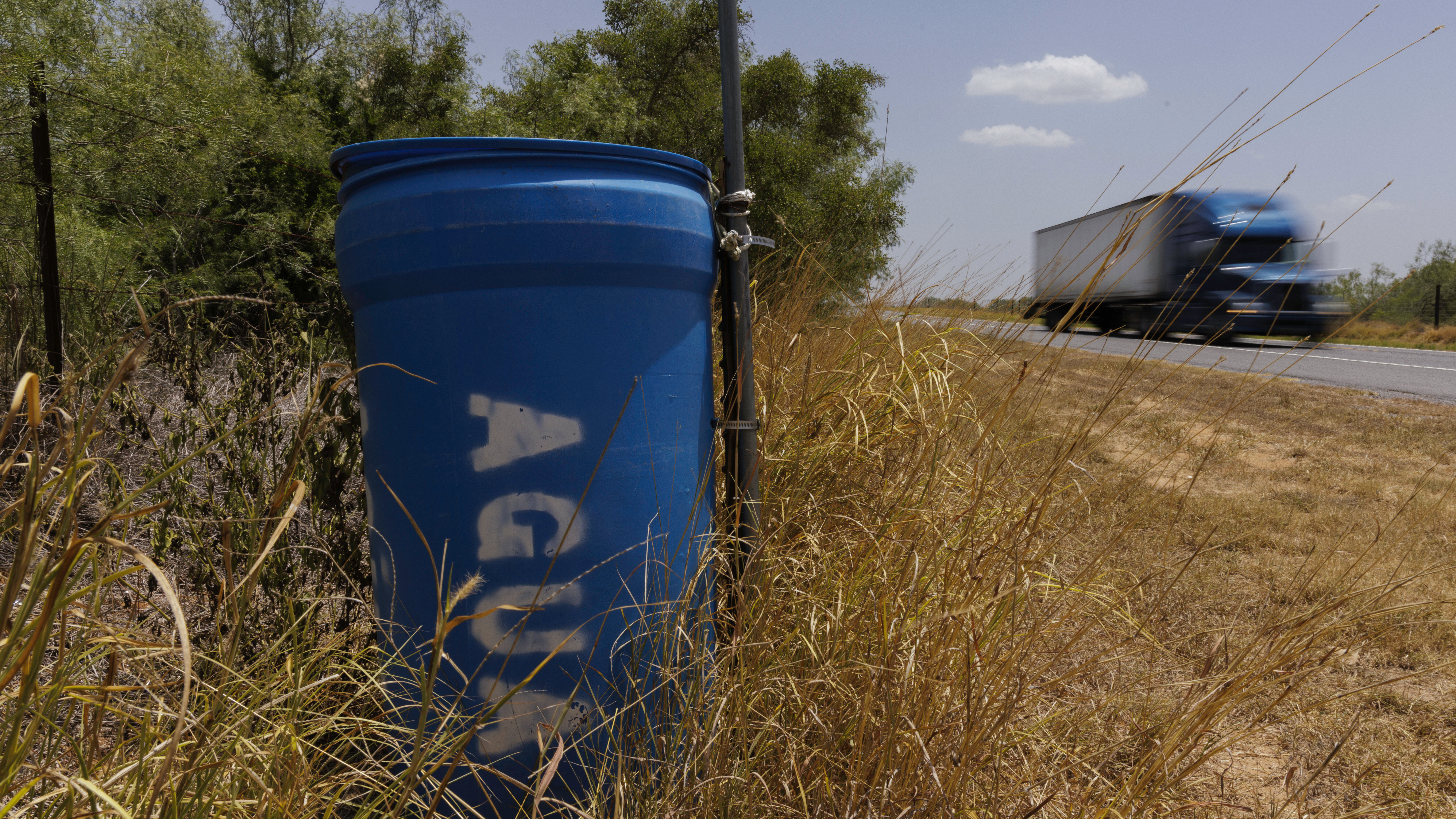 Barrels of drinking water for migrants walking through Texas have disappeared 