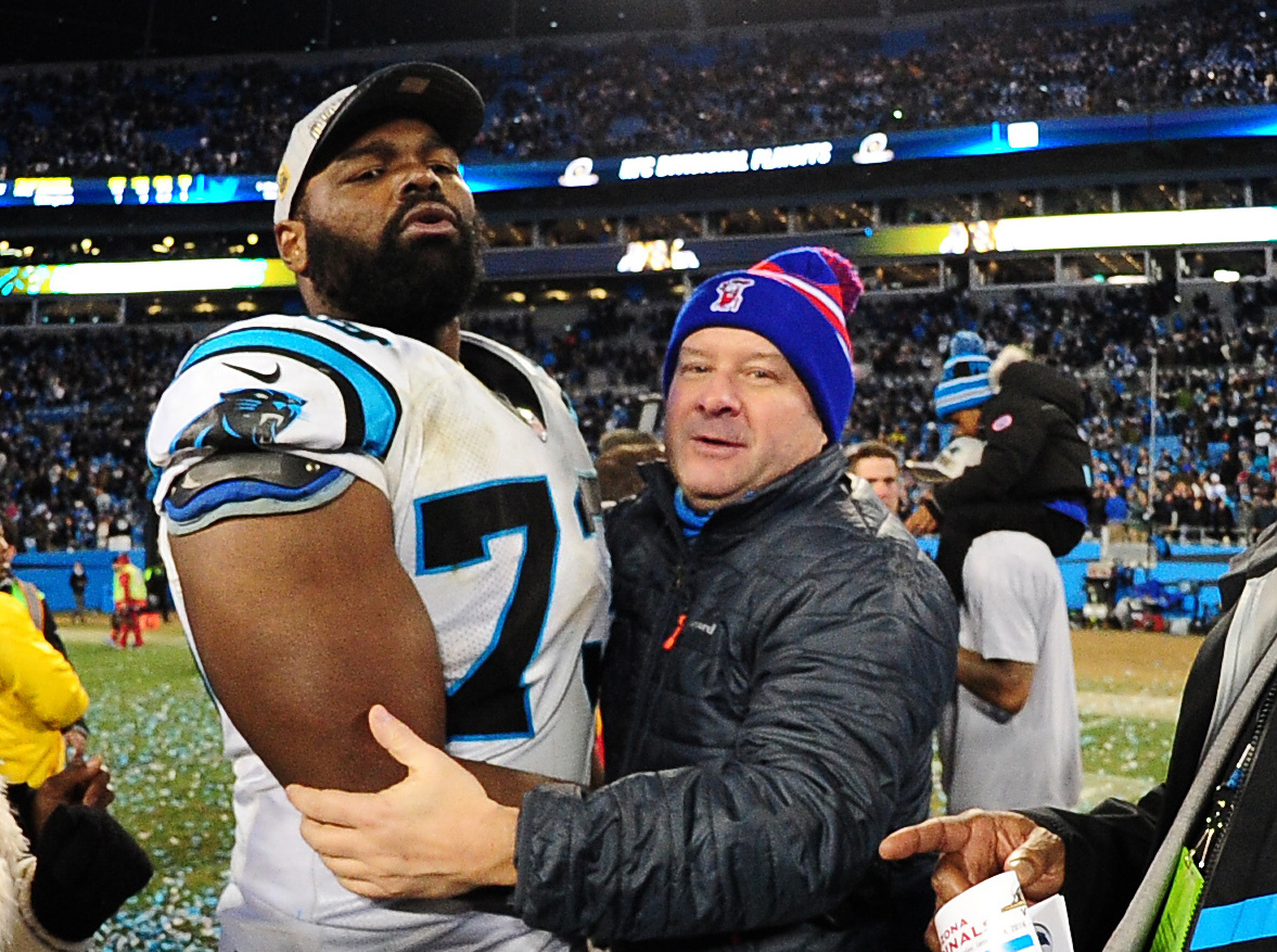 Michael Oher of the Carolina Panthers celebrates with his family after the NFC Championship Game against the Arizona Cardinals at Bank Of America Stadium on January 24, 2016 in Charlotte, N.C. (Getty Images)