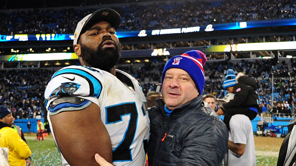 Michael Oher of the Carolina Panthers celebrates with his family after the NFC Championship Game against the Arizona Cardinals at Bank Of America Stadium on January 24, 2016 in Charlotte, N.C.