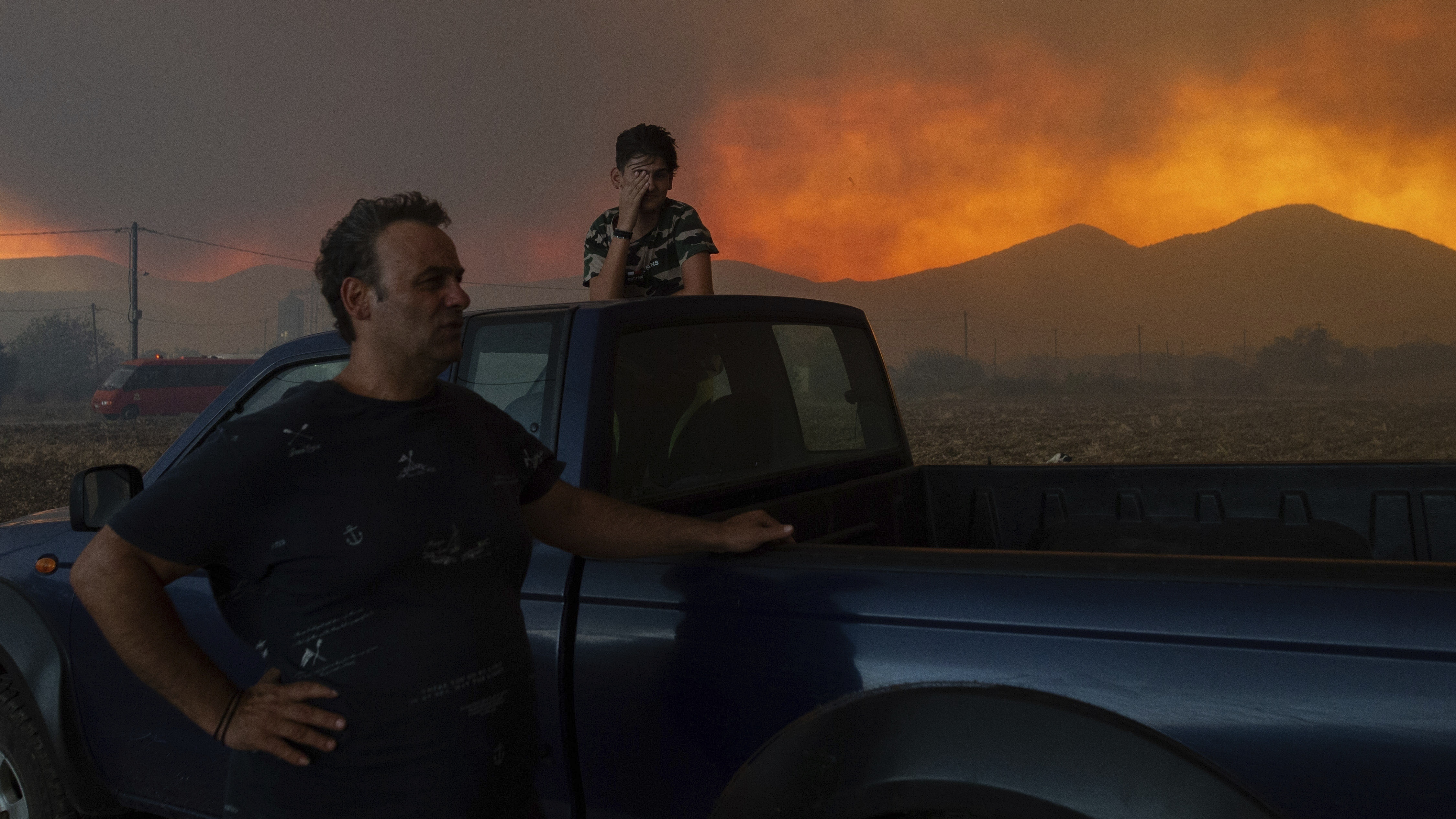 Greek authorities find 18 bodies as they continue to combat raging wildfires