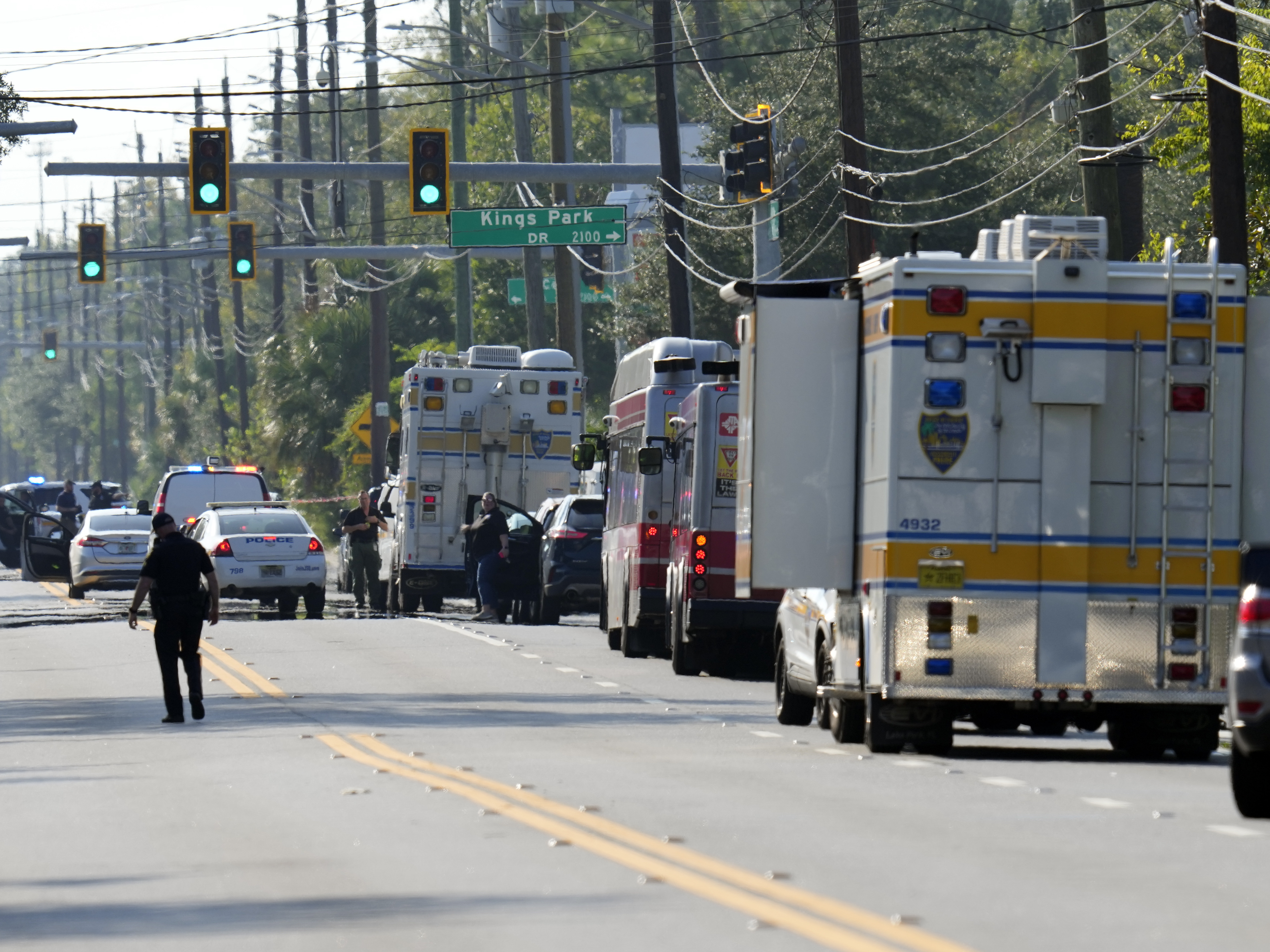 People mourn victims of the Florida shooting as a hate crime investigation begins