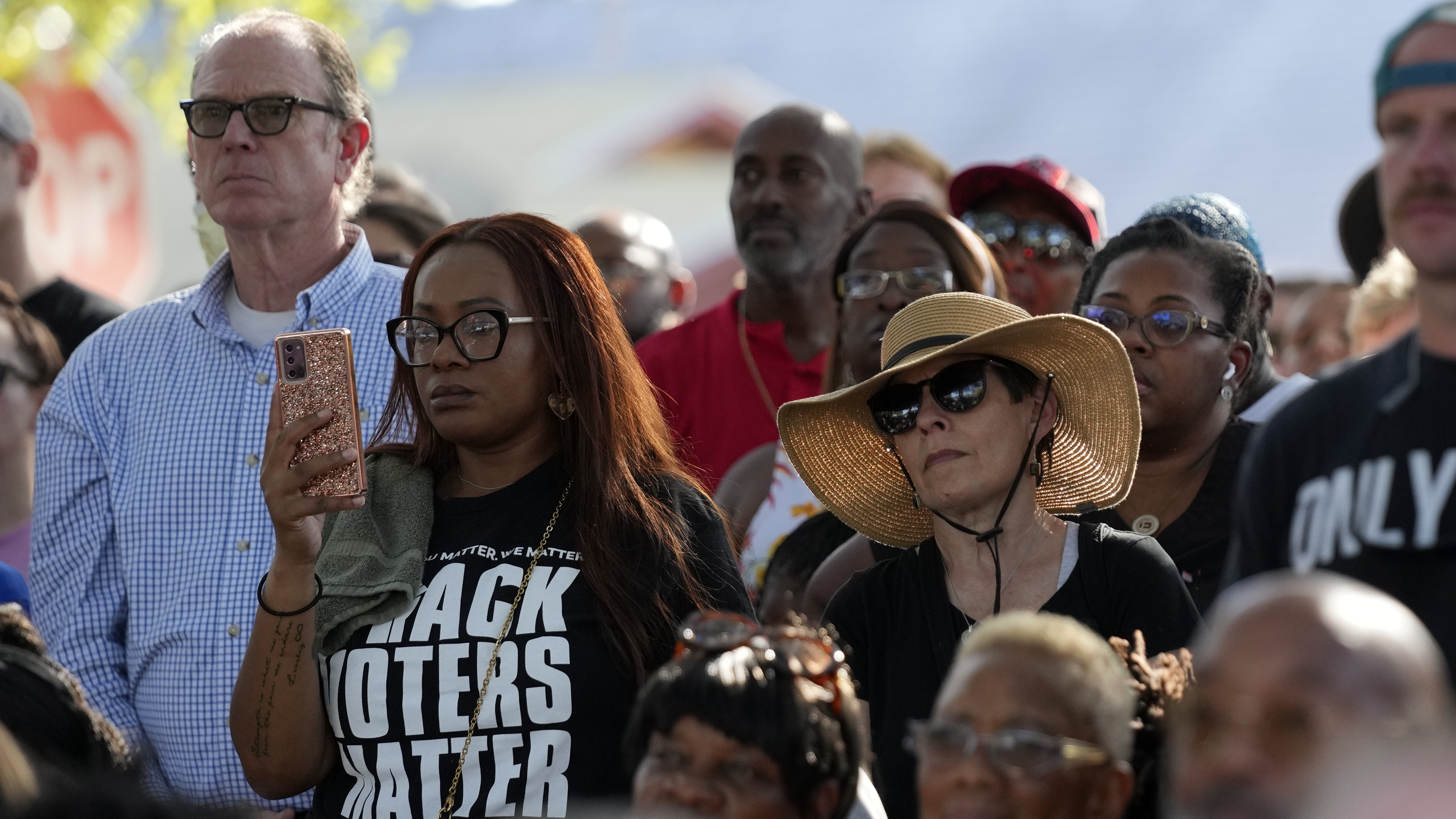 Residents of the Jacksonville community attend a prayer vigil for the victims of Saturday