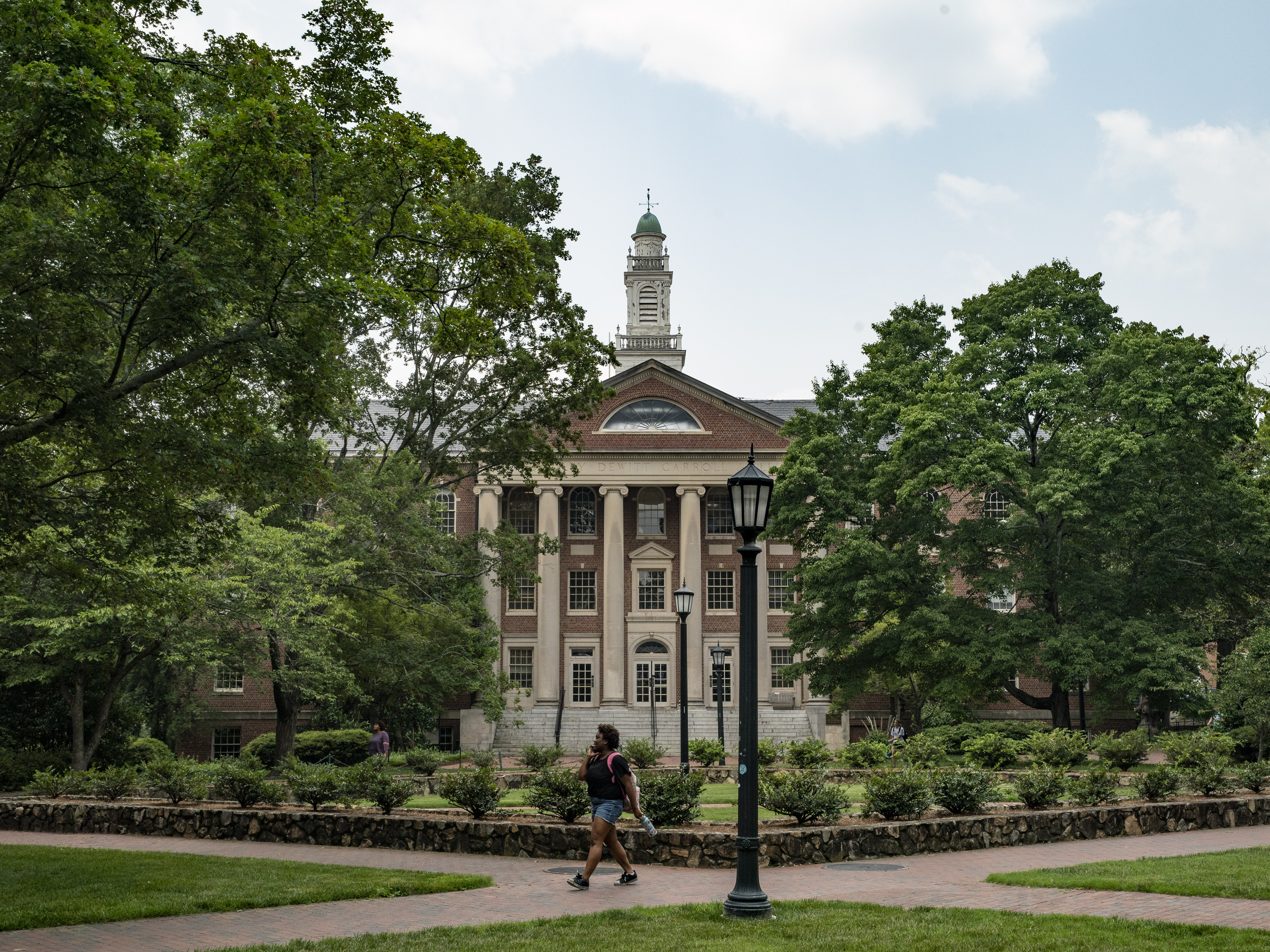 People walk on the campus of the University of North Carolina Chapel Hill in June. (Getty Images)
