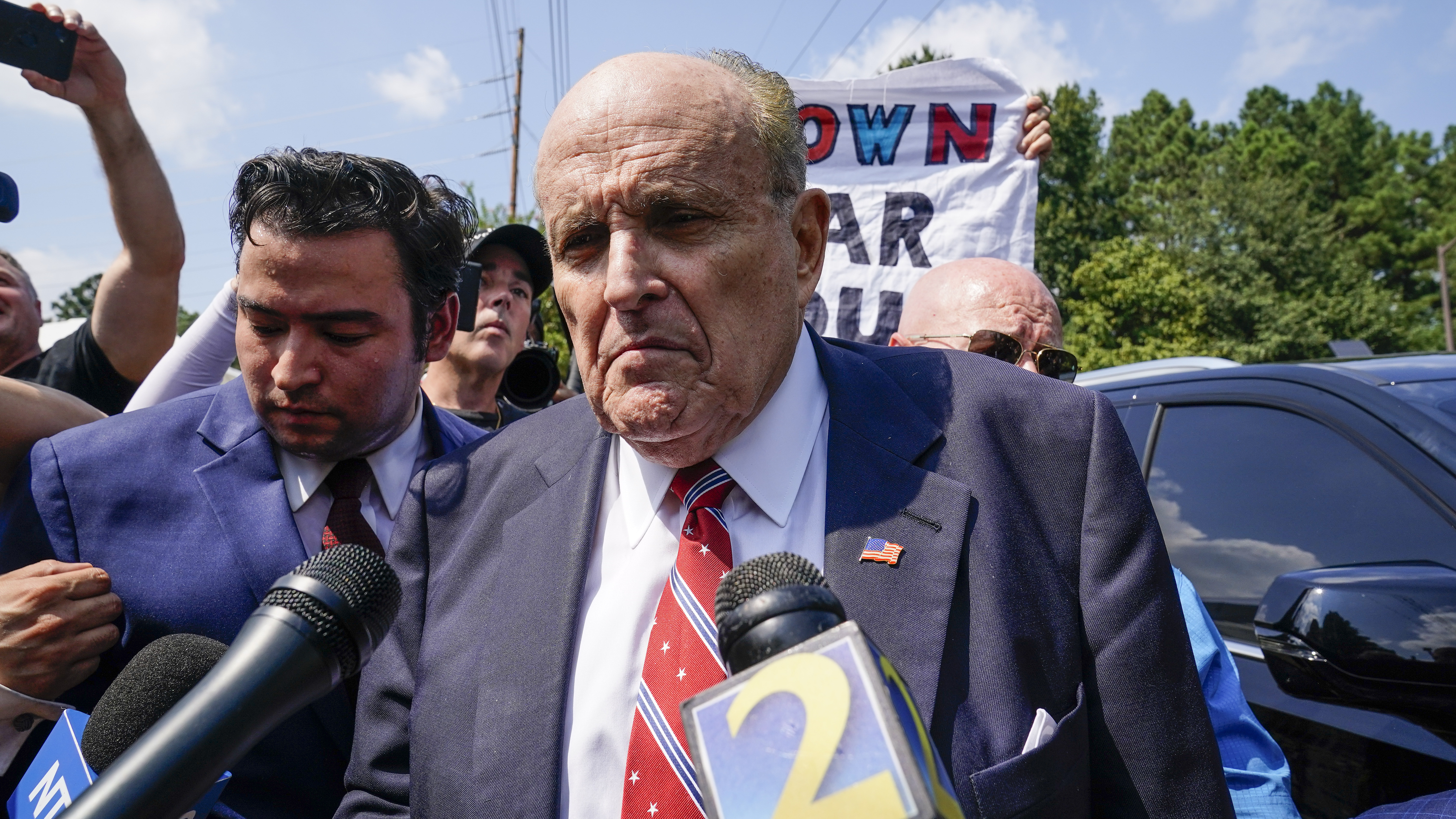 Rudy Giuliani speaks outside the Fulton County jail in Atlanta on Aug. 23, before he surrendered on 13 felony charges related to efforts to try to overturn the 2020 election.
