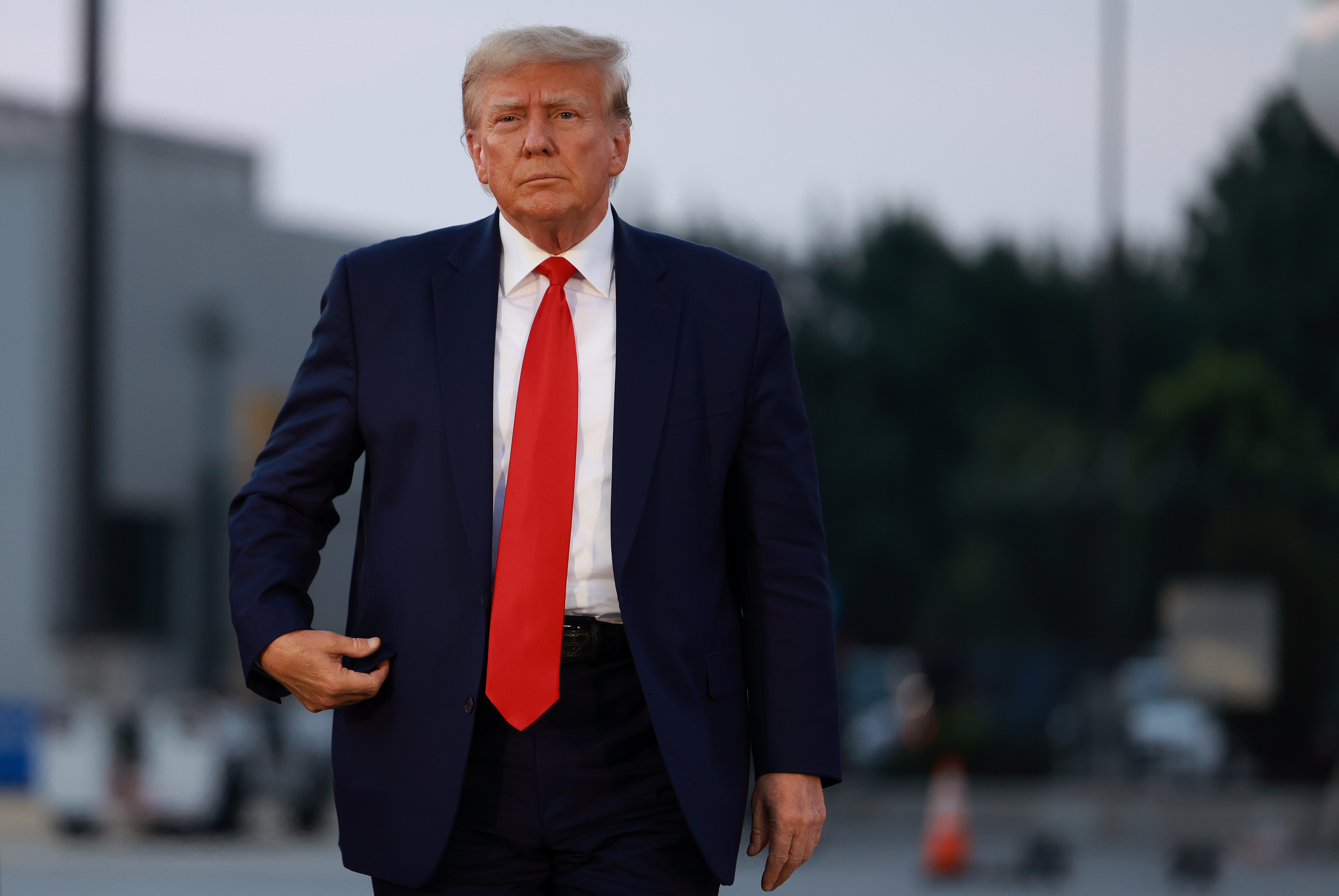Former President Donald Trump arrives at Atlanta Hartsfield-Jackson International Airport after being booked at the Fulton County jail on Aug. 24. (Getty Images)