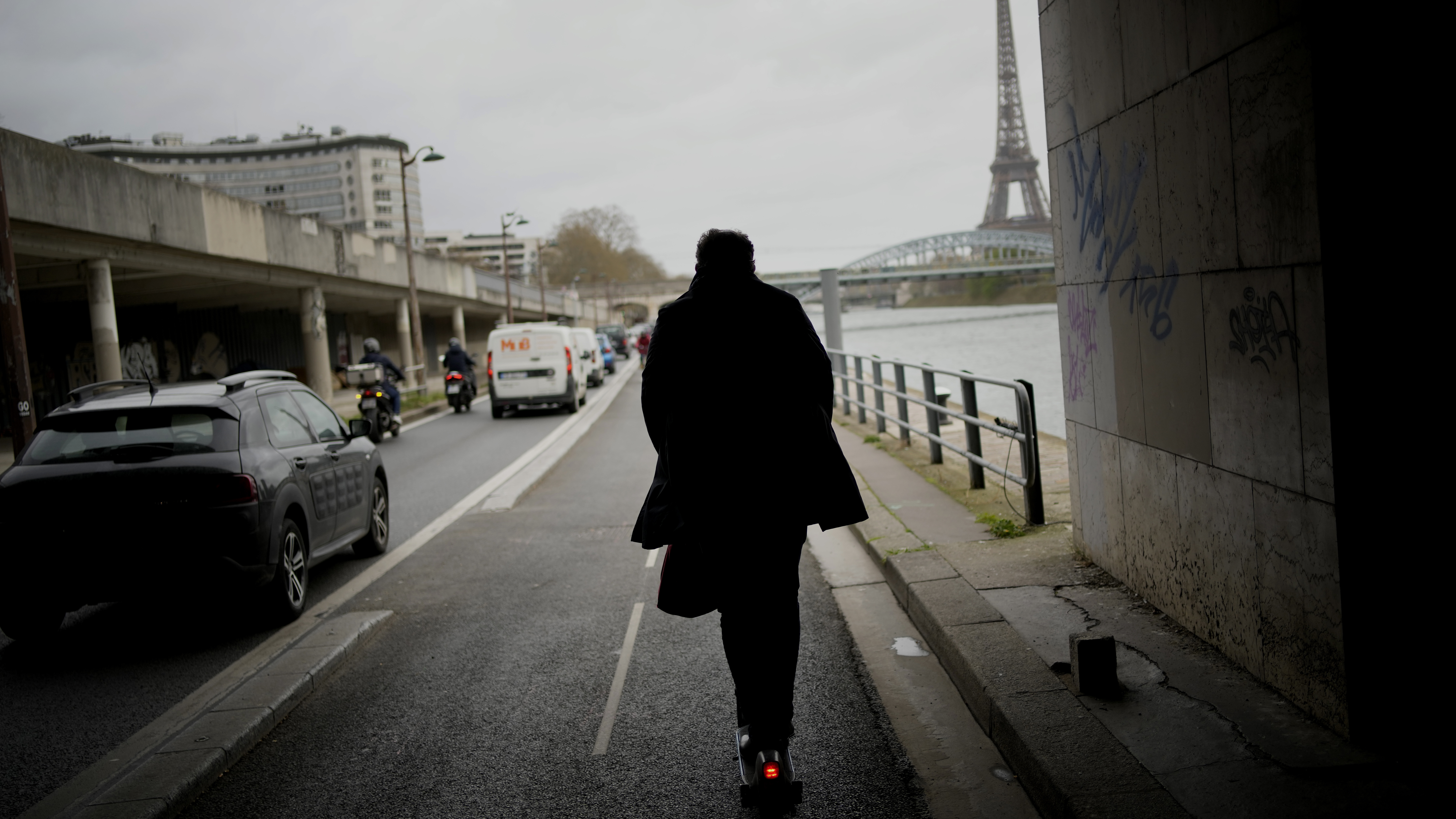 A man rides a scooter in Paris, on March 31. The city has now banned rental electric scooters.