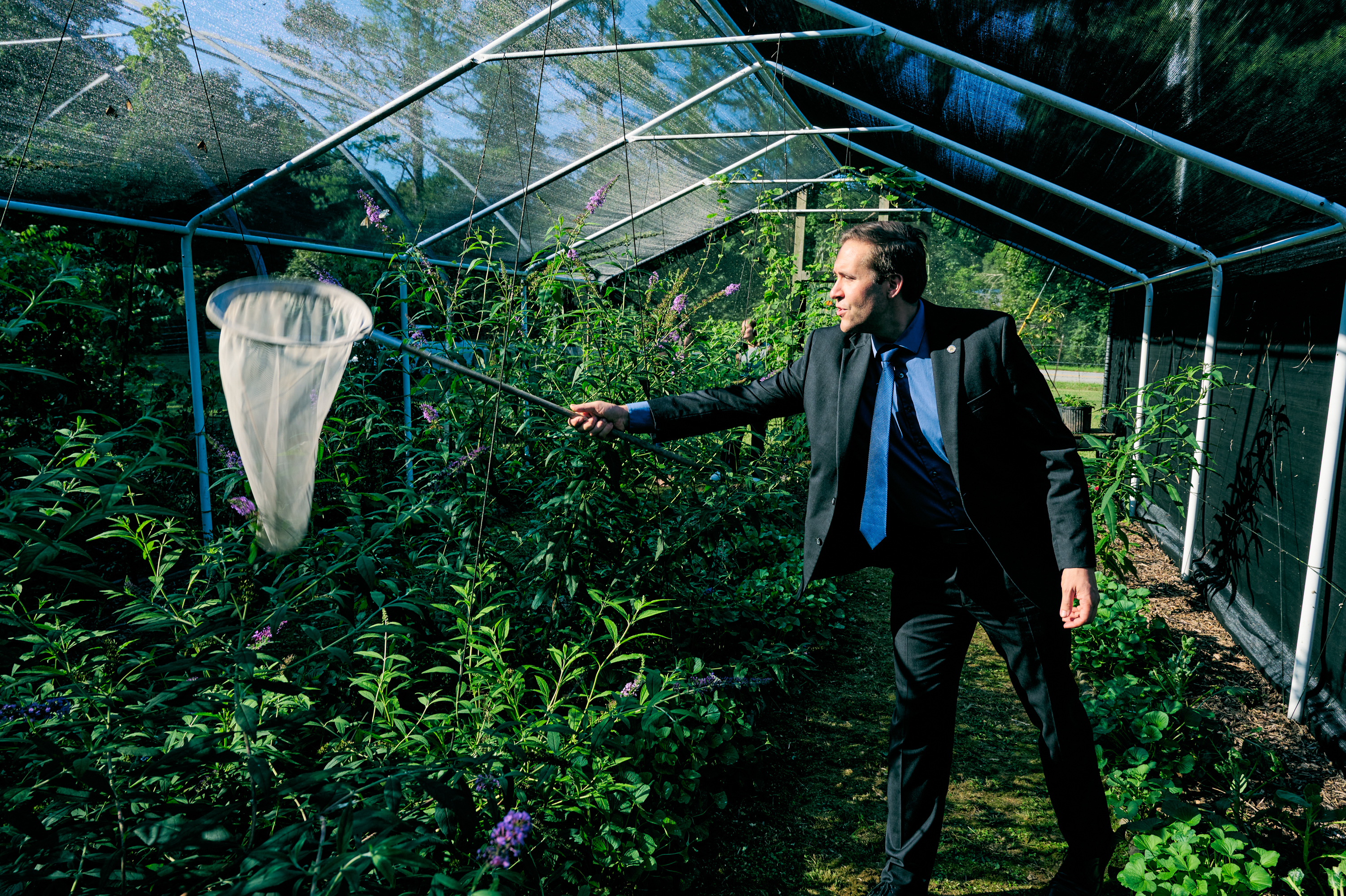 John Wahl, 37, is the youngest GOP state party leader in the country. He also runs a business as a butterfly farmer in Athens, Ala. &quot;This is me, the chairman of the Alabama Republican Party, in his natural habitat,&quot; he told NPR during a visit to his butterfly farm. (Quentin Renard Gunn for NPR)