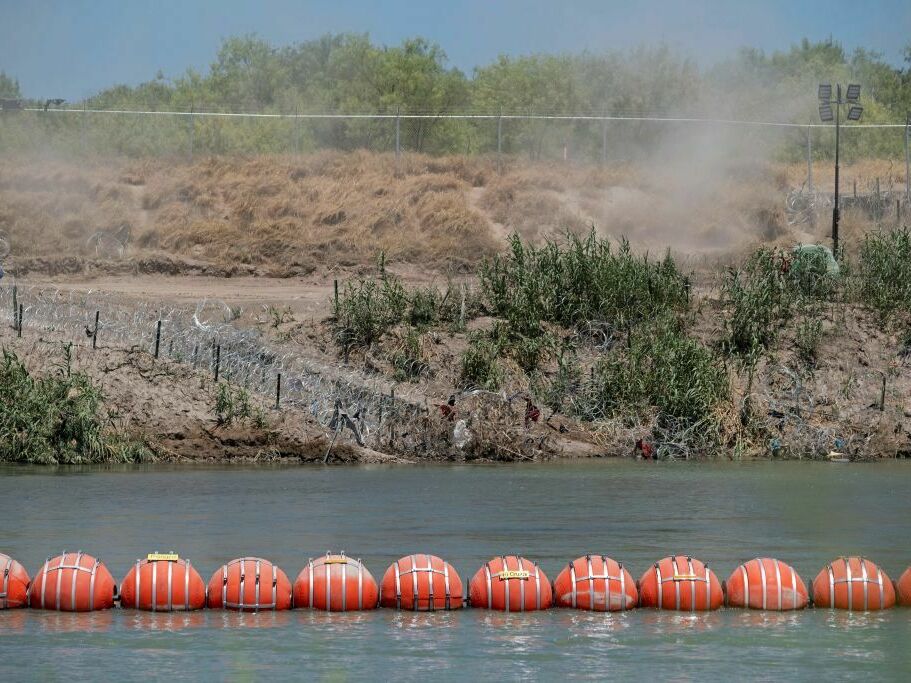A barrier to deter migrants from crossing from Mexico into the U.S. floats in the Rio Grande at Eagle Pass, Texas. (AFP via Getty Images)