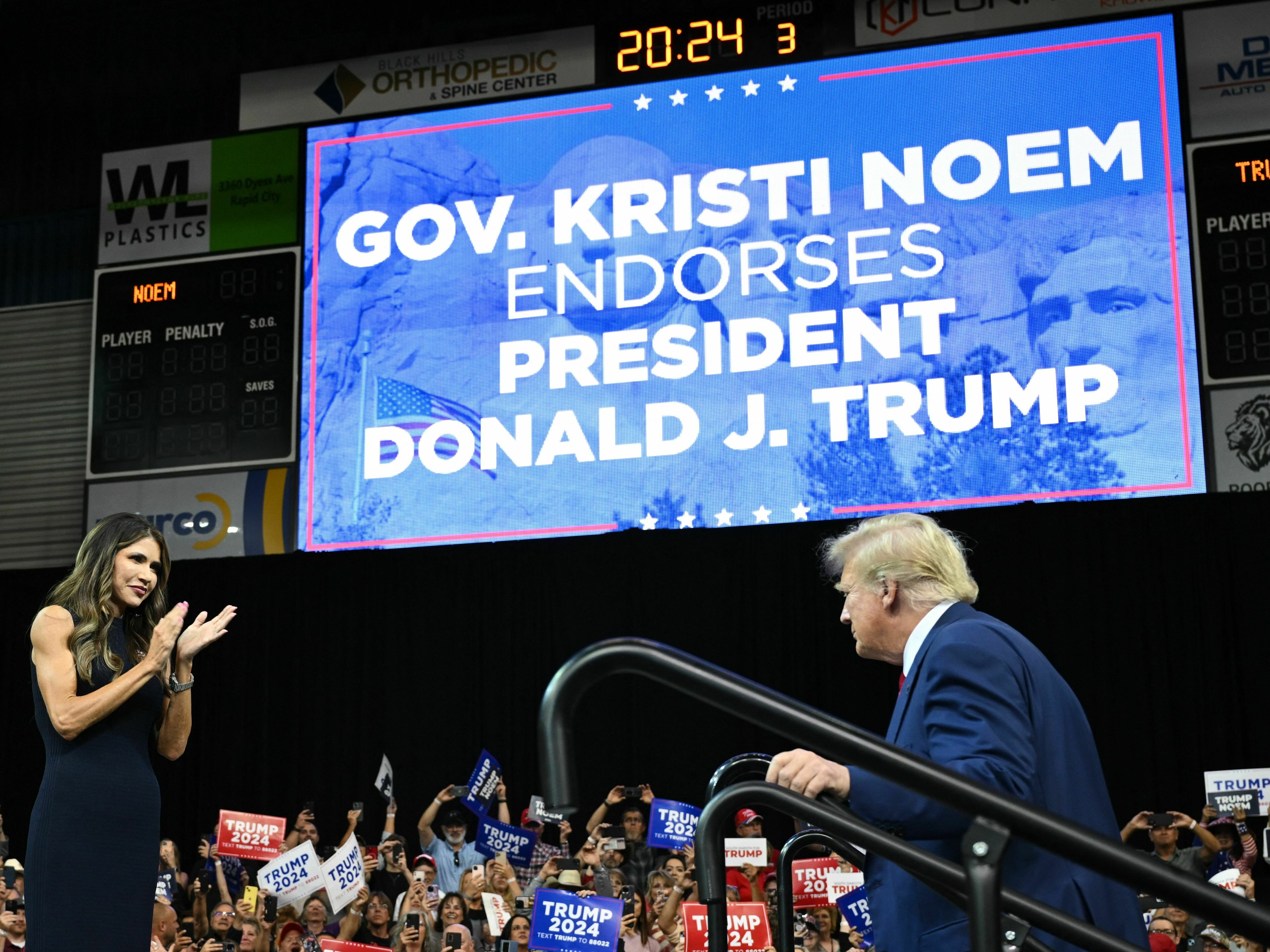 South Dakota Governor, Kristi Noem welcomes 2024 Republican Presidential hopeful Donald Trump to the stage during a rally in Rapid City, South Dakota. (AFP via Getty Images)