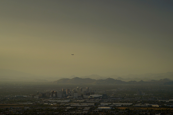 Clouds surround downtown Phoenix at sunset on July 30, 2023.