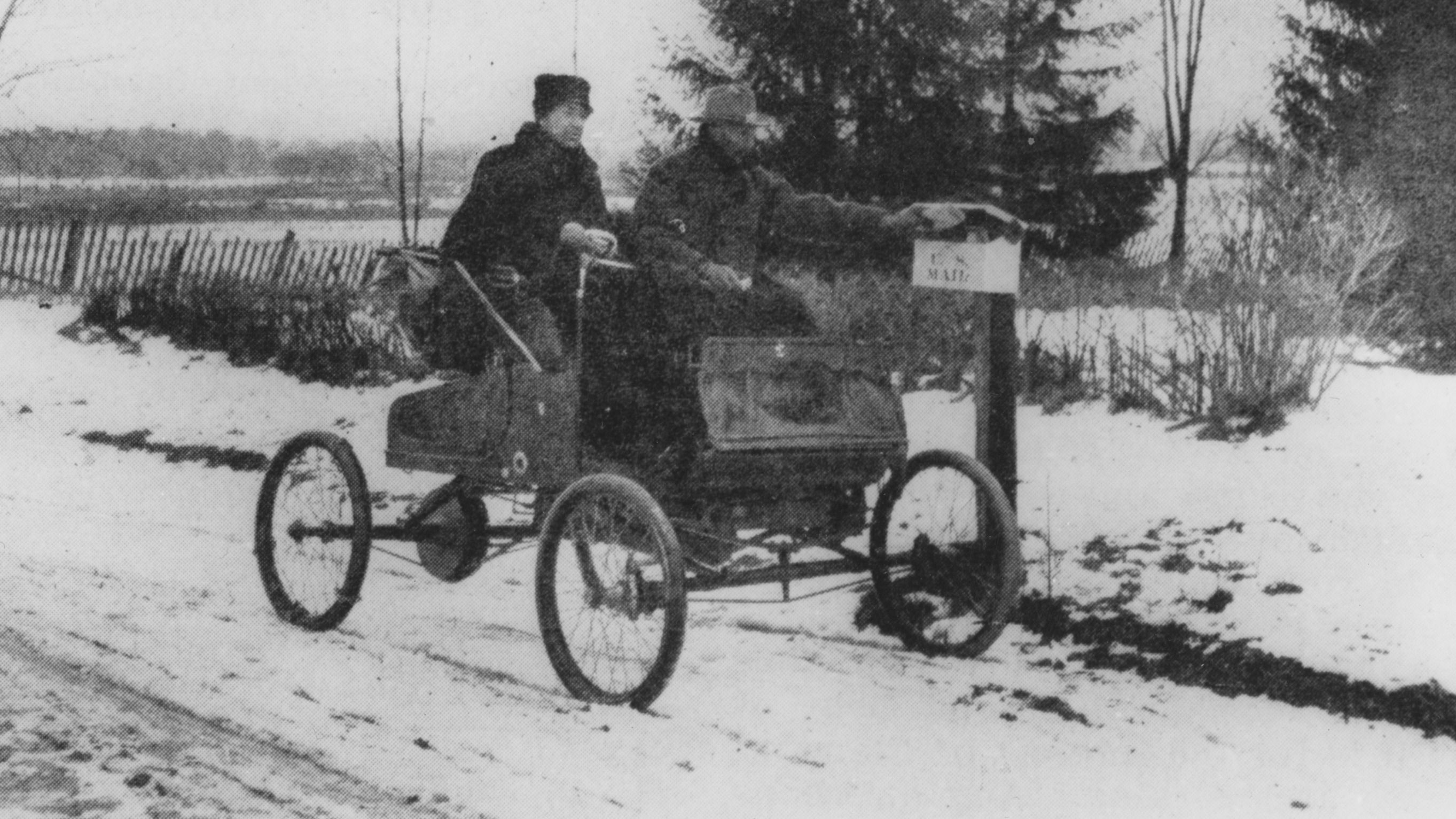 A rural mail carrier in 1905 trying out new transportation technology.