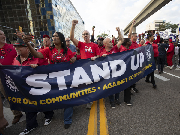 UAW President Shawn Fain marches with UAW members through downtown Detroit after a rally in support of United Auto Workers members as they strike the Big Three auto makers on September 15, 2023 in Detroit, Michigan.