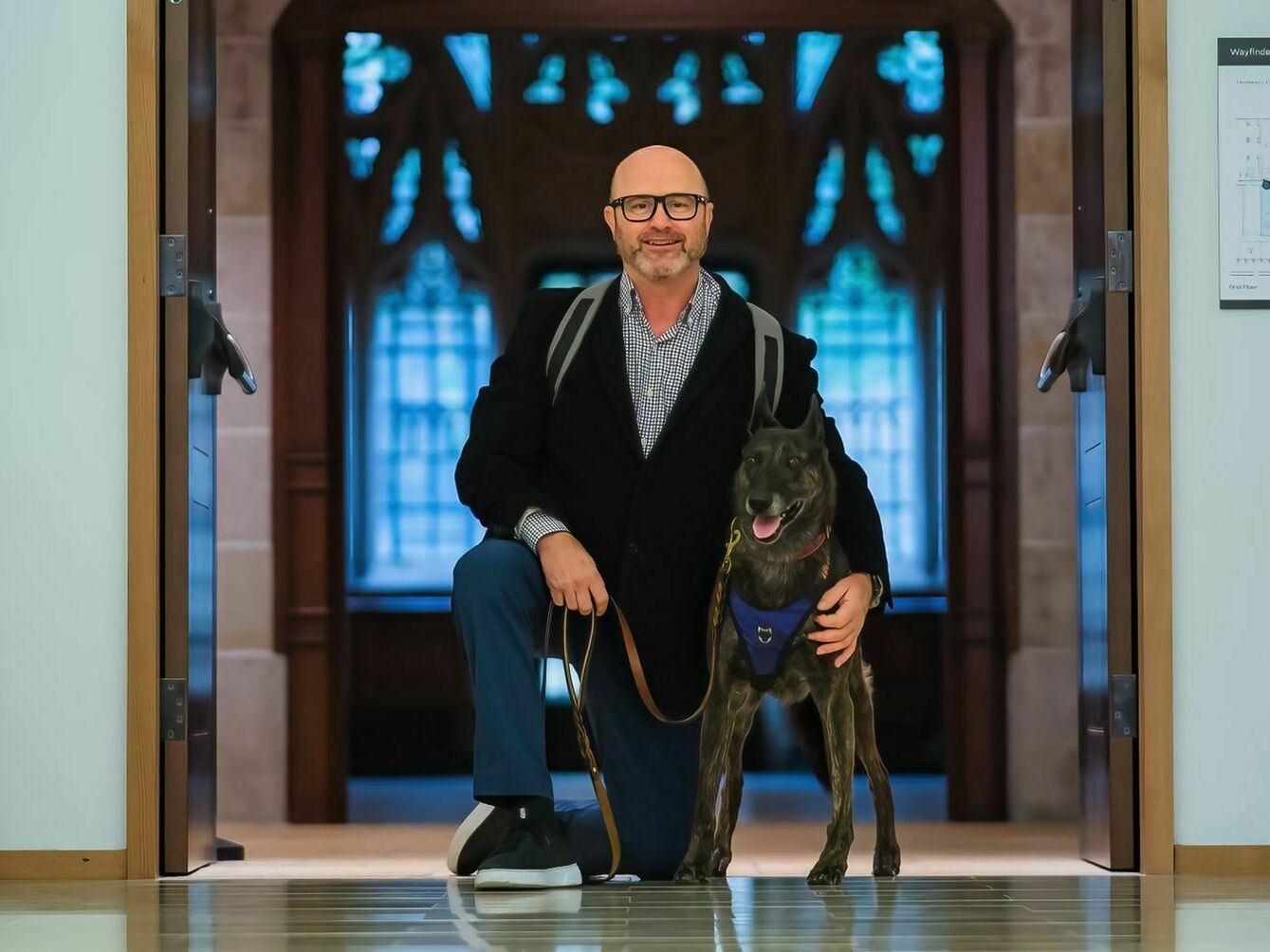 James Hatch was a dog handler in the military. At Yale, he's often accompanied in class by his service dog, Mina. (Erik Larson)