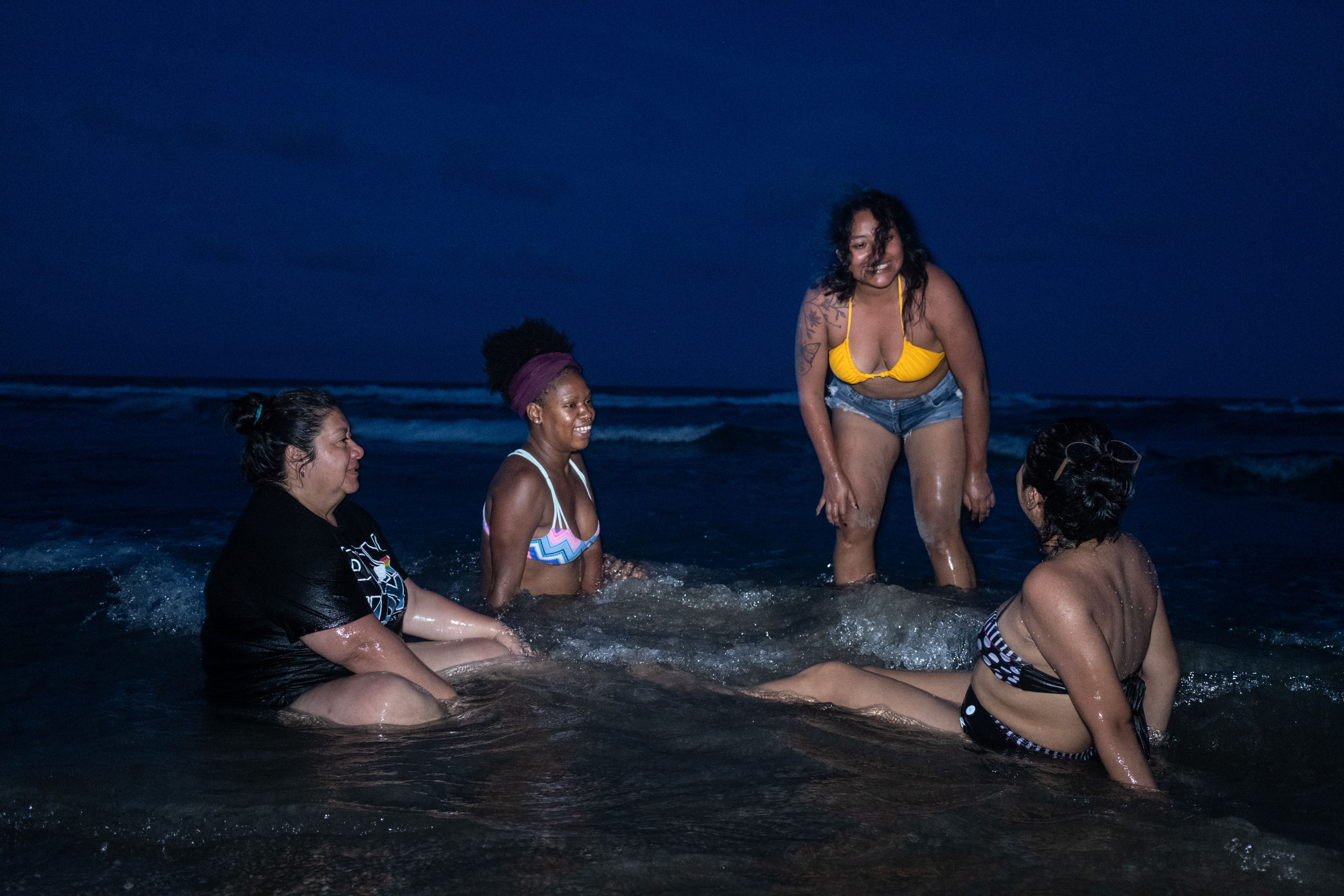 Women of the Sea: Afro-descendants honor their heritage in Mexico 6 Cecilia Estrada, Odalys Gonzalez, Alitzel Diaz and Jessica Tomas after the Afro-Mexican women's meeting, rest on Tamiahua beach at sunset on July 23.