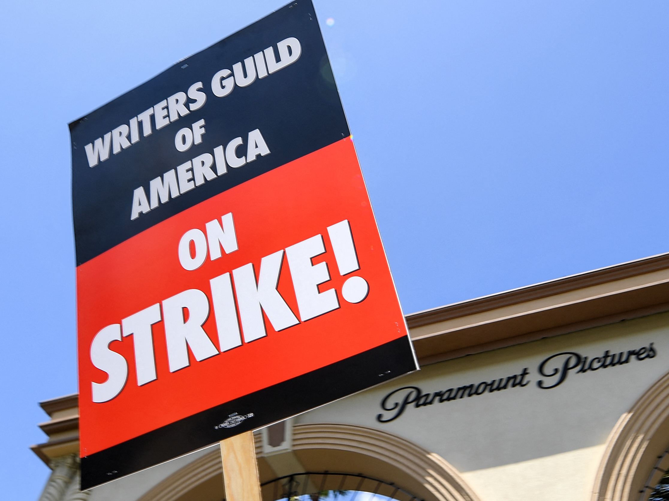 Up First briefing: Hollywood writers deal, NASA asteroid sample, pickleball caucus 1 Screenwriters on strike protest in front of Paramount Studios on May 2, 2023 in Los Angeles, California.