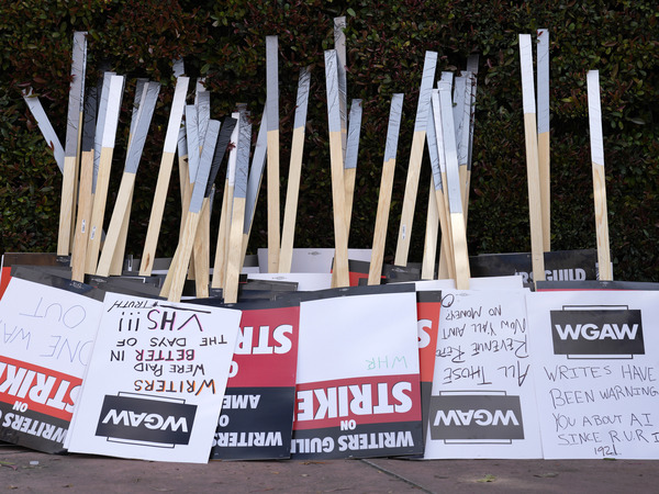 Placards are gathered together at the close of a picket by members of The Writers Guild of America outside Walt Disney Studios, Tuesday, May 2, 2023, in Burbank, Calif.