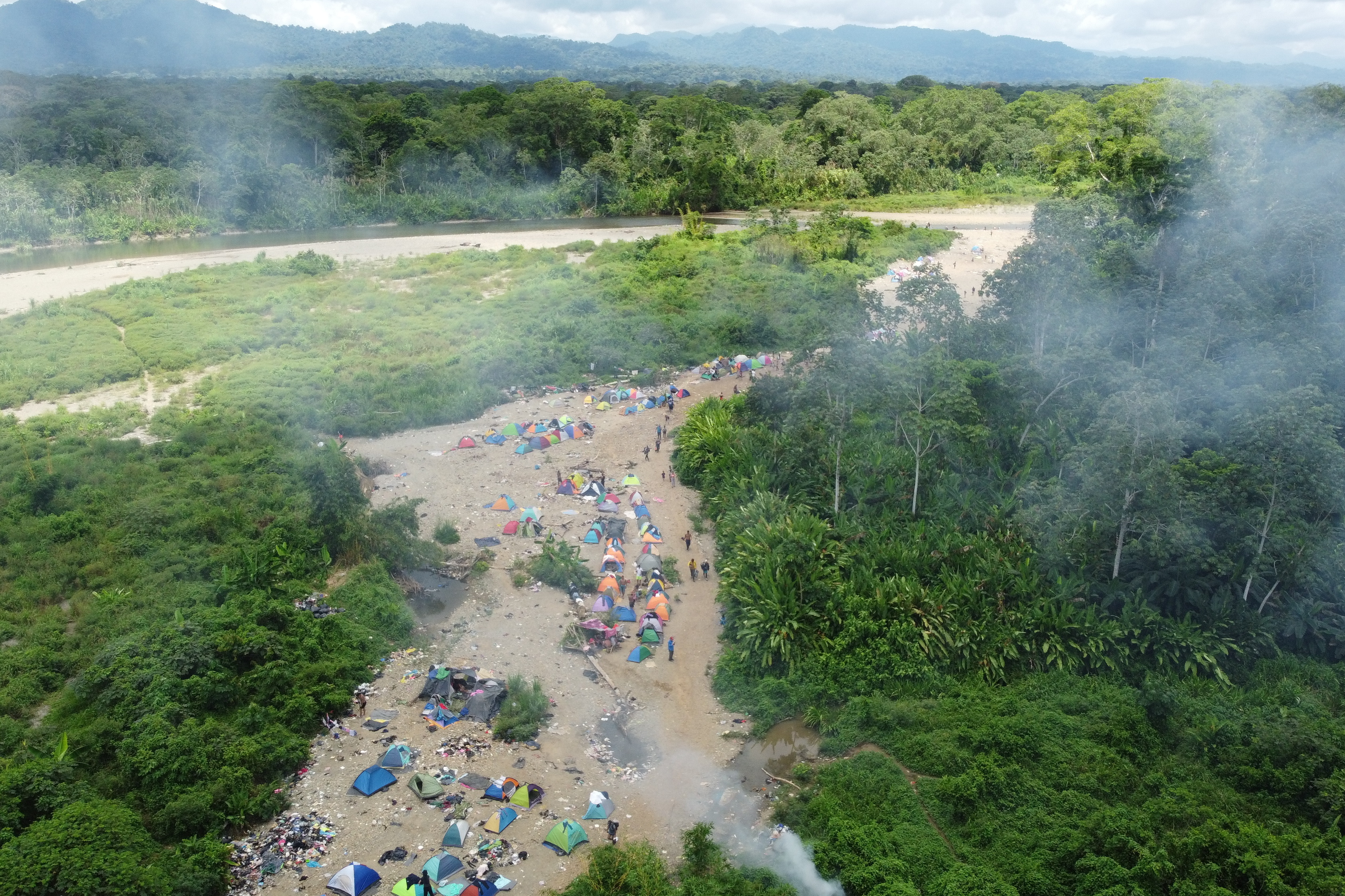 Hundreds of people sleep in tents each day outside Bajo Chiquito, the first village that migrants encounter in Panama after making the grueling trek across the Darién jungle. (Manuel Rueda)