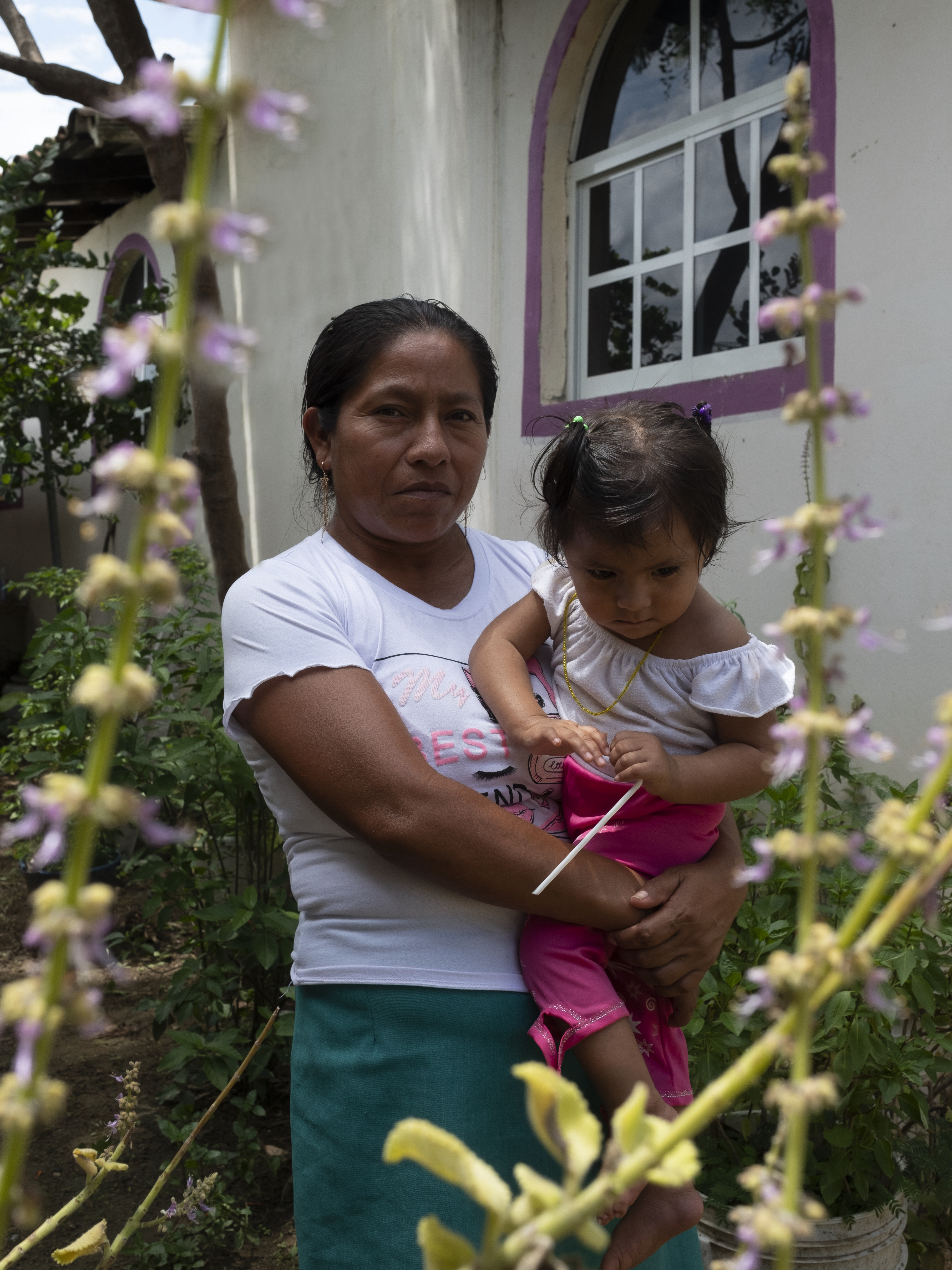 These Indigenous Mexican women are reclaiming their power through ancestral practices 11 Paula Cano, a traditional midwife, holds her youngest child, who suffers a disability in her motor system. Paula thinks her daughter's disability is a result of her cesarean birth and because she wasn't allowed to keep the placenta to conduct the proper rituals.