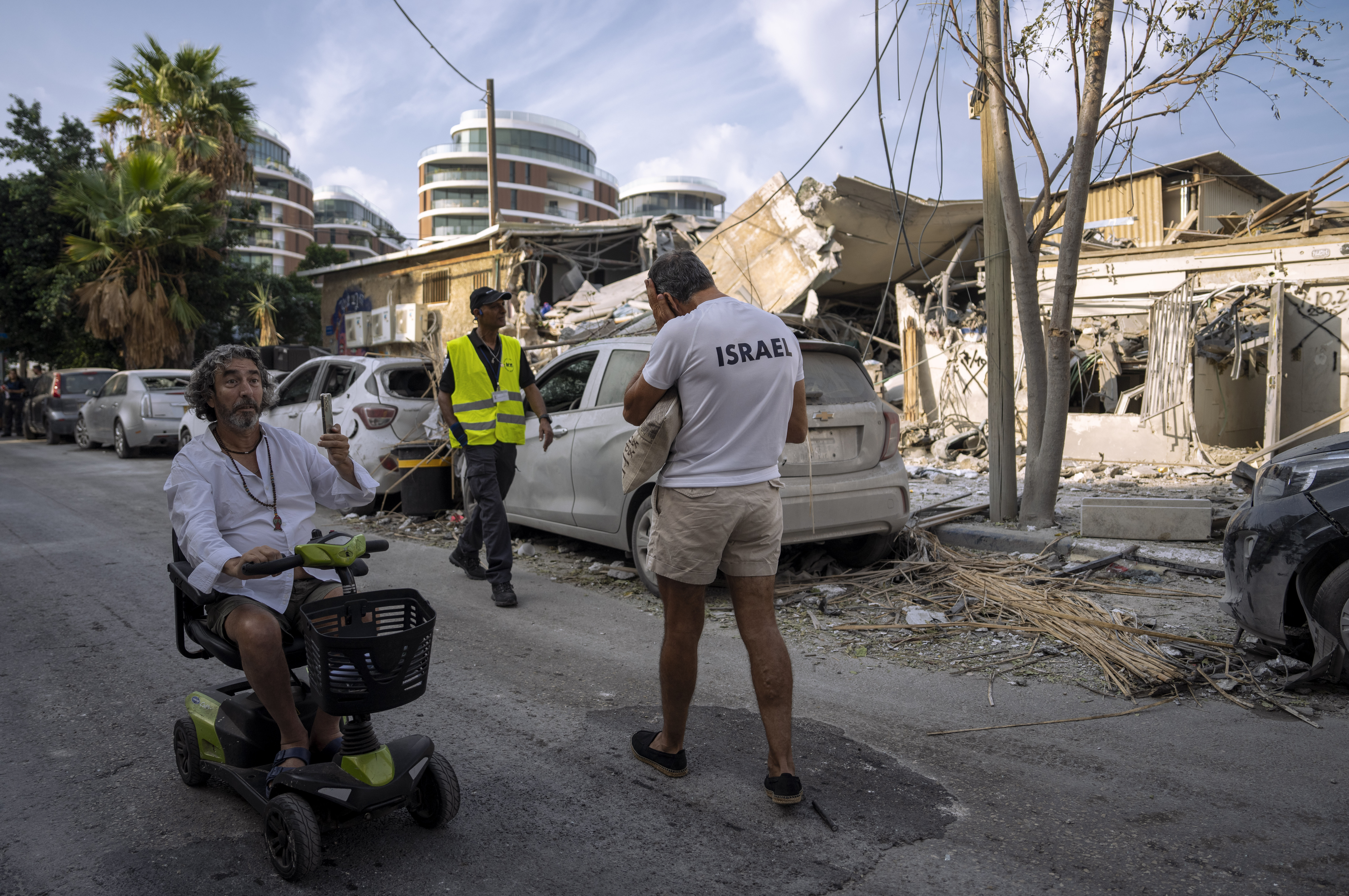 Sun., Oct. 8: Israelis inspect the rubble of a building a day after it was hit by a rocket fired from the Gaza Strip, in Tel Aviv, Israel.