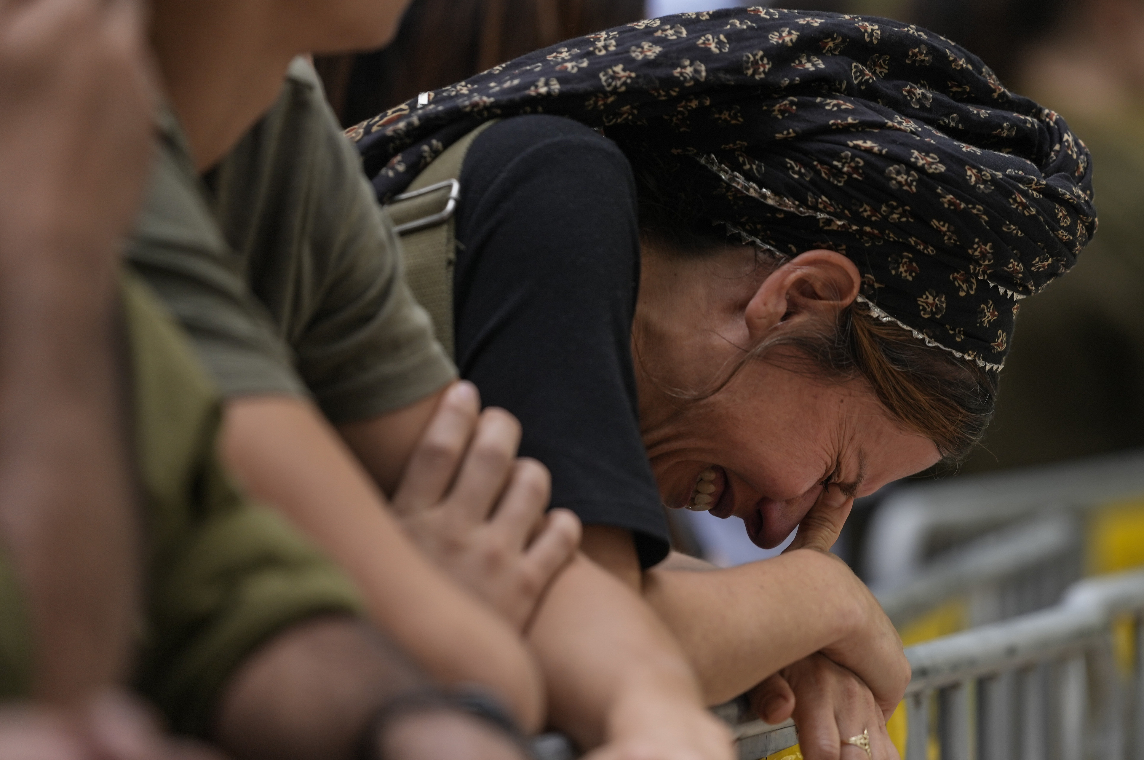 Mon., Oct. 9: A woman cries during the funeral of Israeli Col. Roi Levy at the Mount Herzl cemetery in Jerusalem.