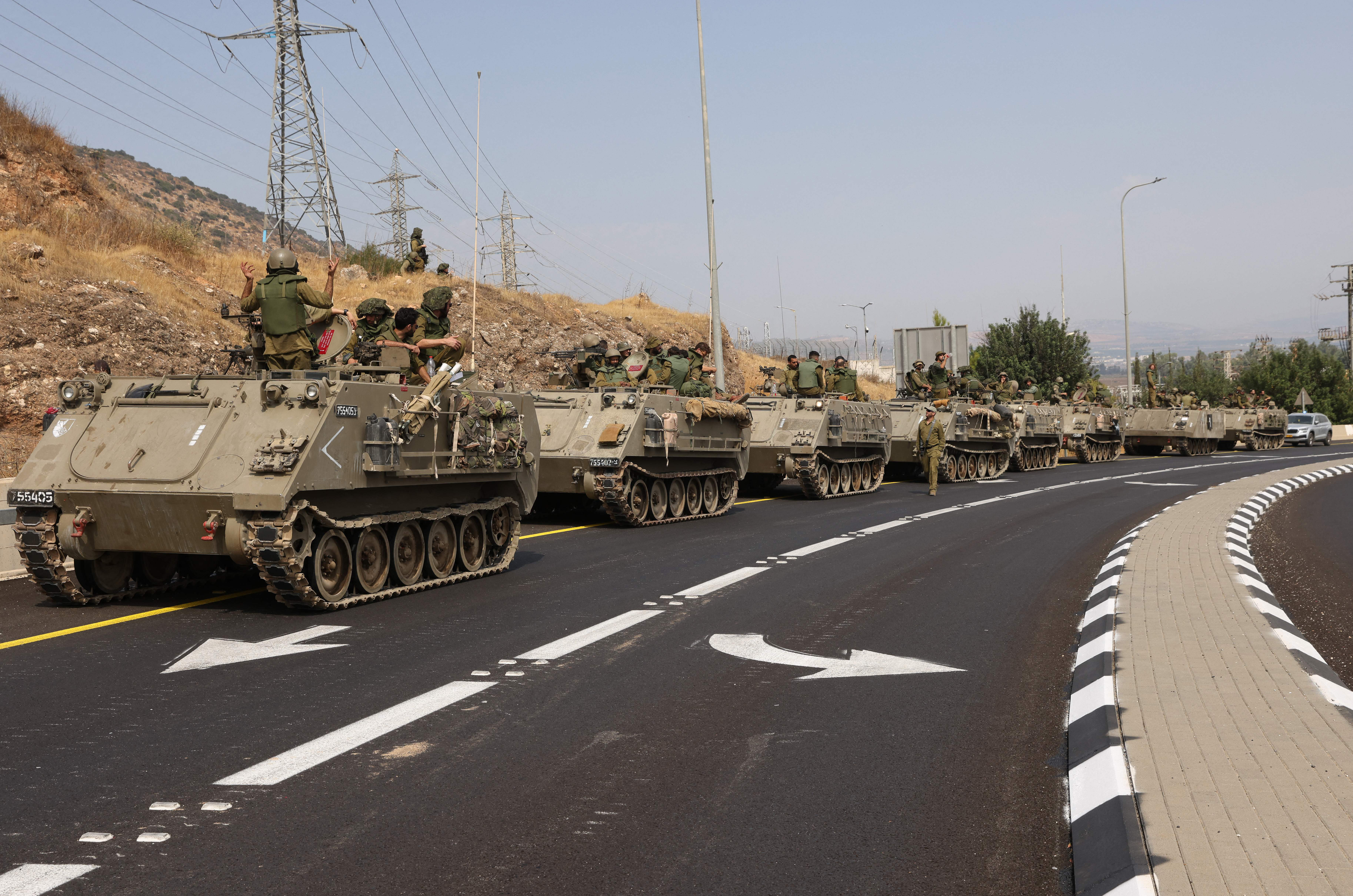 Mon., Oct. 9: Israeli soldiers in an armoured vehicles drive along a street near northern town of Kiryat Shmona close to the border with Lebanon.